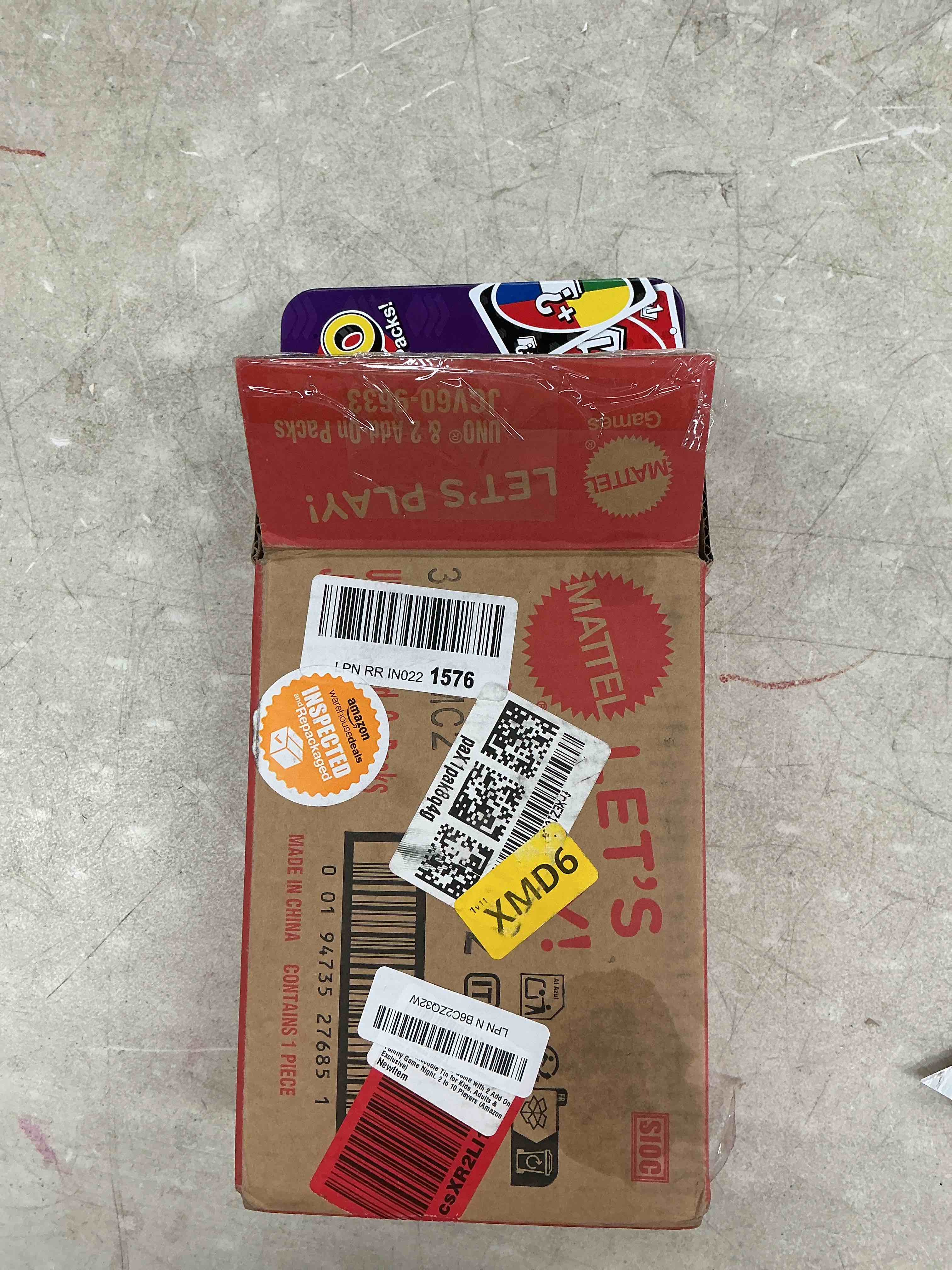 Condition photo showing Good Condition for mattel games uno card game with 2 add on packs & collectible tin for kids, adults & family game night. 2 to 10 players (amazon exclusive) uno w/add-on reverse + stack packs