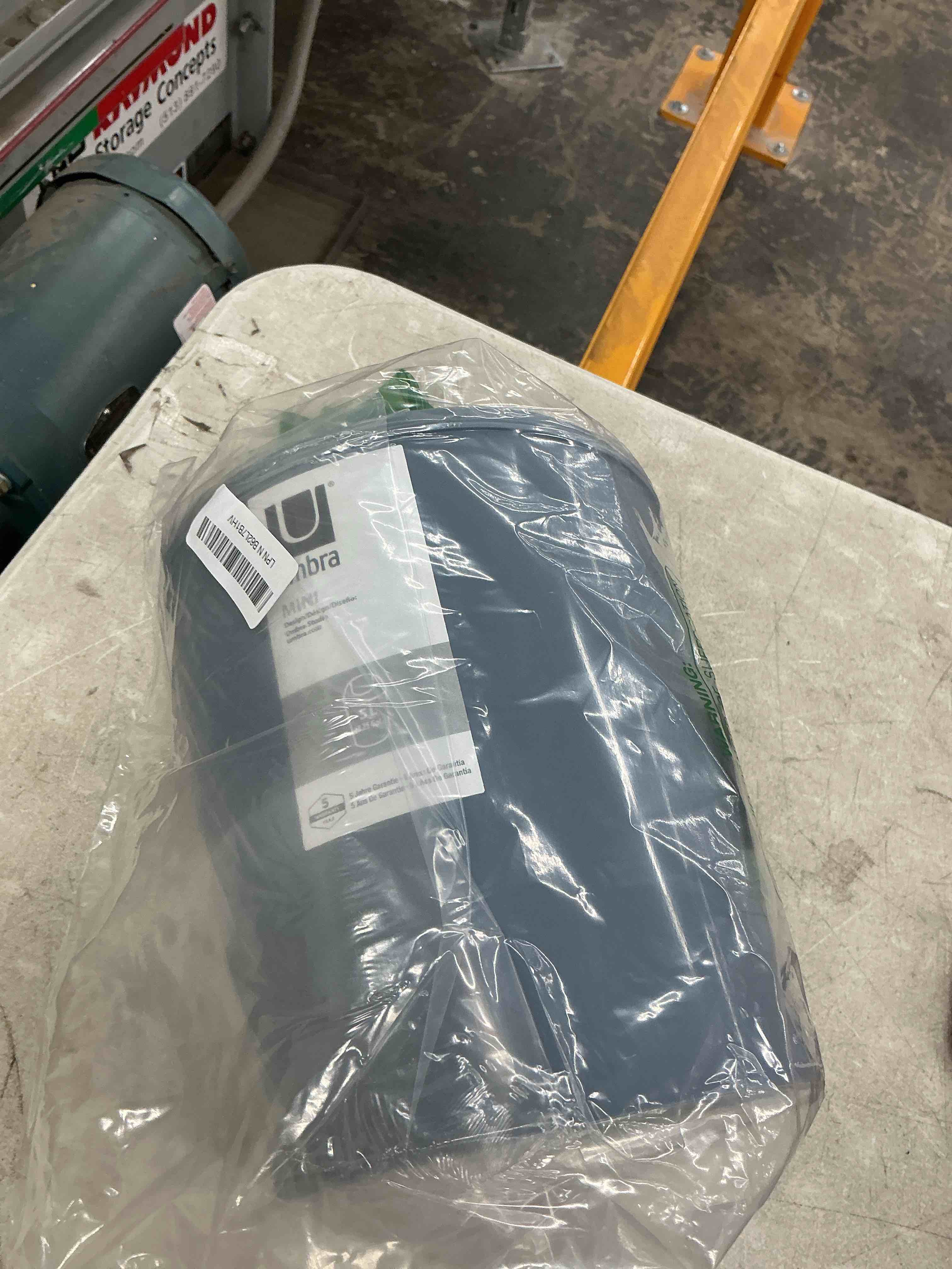 Condition photo showing Good Condition for umbra 1.25 gallon mini waste can with removable swing-top lid - small garbage bin for kitchen, bathroom, bedroom, office - compact trash can fit under tables & counters - steel blue