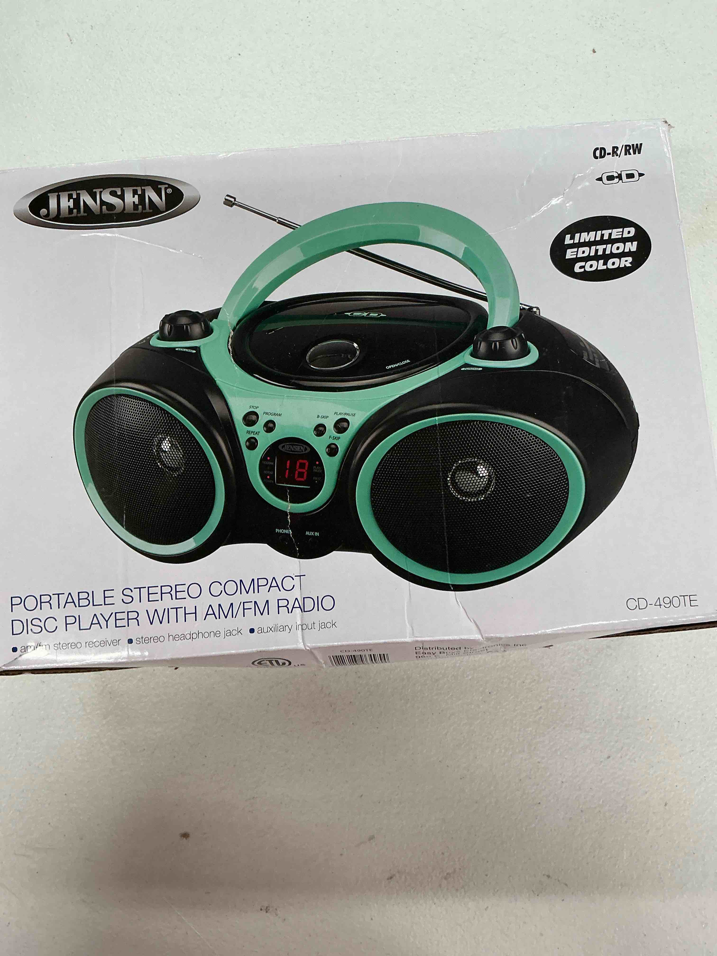 Condition photo showing New/Like New for jensen cd-490 portable sport stereo cd player boombox with am/fm radio, aux line-in & headphone jack (limited edition colors) (aqua teal)
