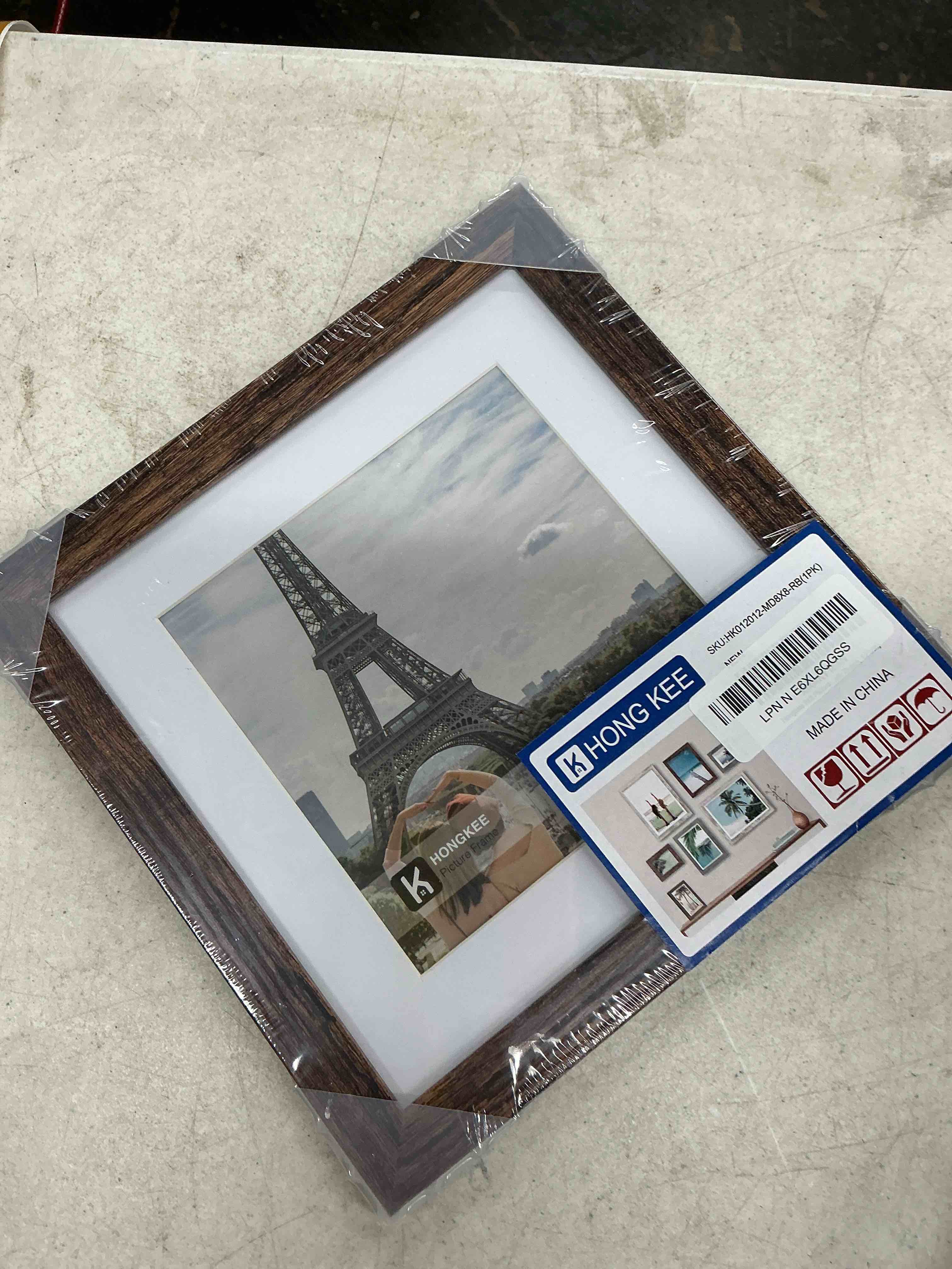 Condition photo showing New/Like New for hongkee 8x8 picture frame with glass, display pictures 6x6 with mat or 8 x 8 without mat - wall and tabletop, 8 by 8 photo wooden frames (rustic brown, 1 pack) rustic brown 8x8 in