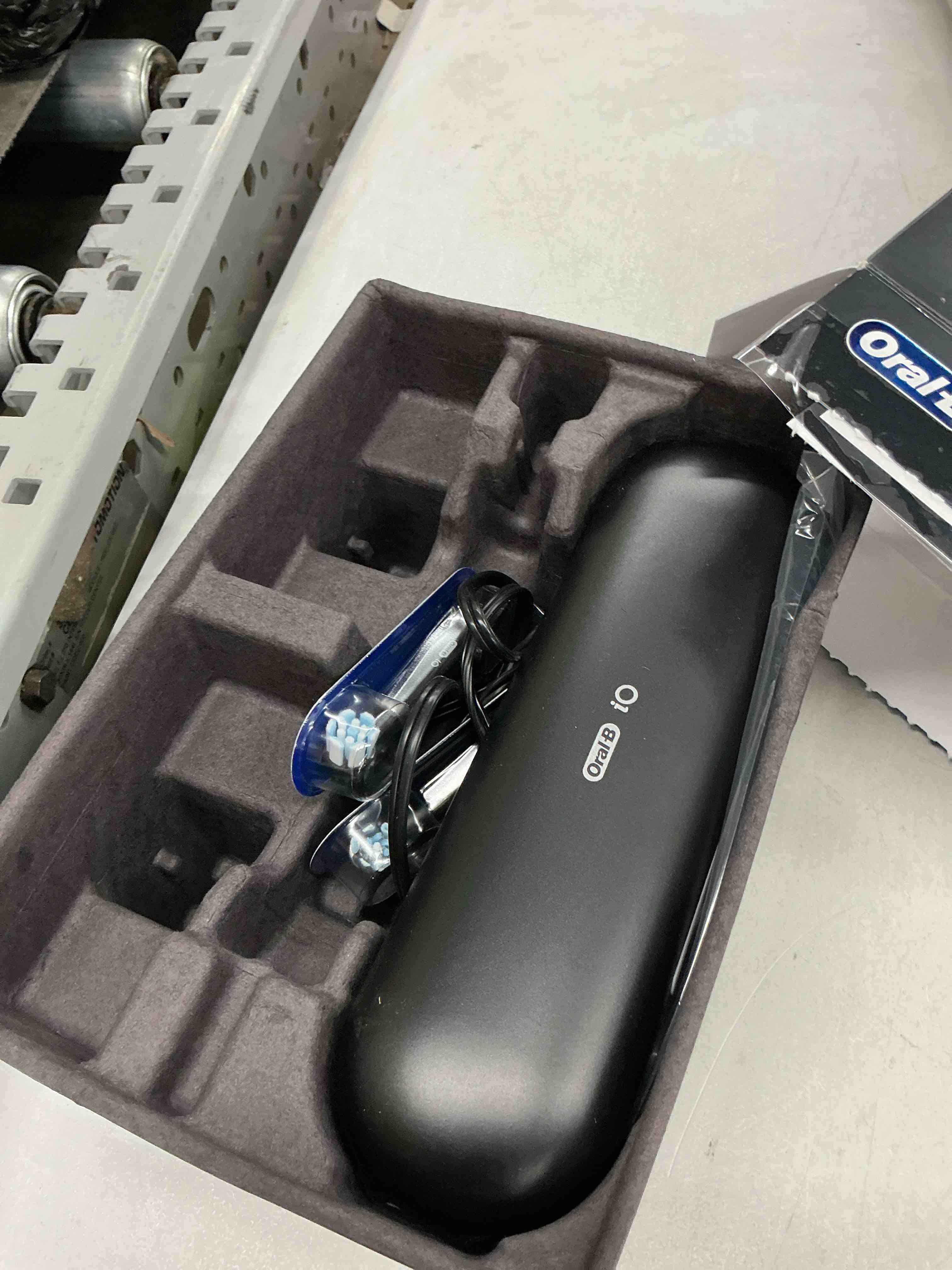 Condition photo showing Good Condition for oral-b rechargeable electric toothbrush, io9 limited ultimate clean, 7 cleaning modes, interactive display, isense charger, charging travel case, visible pressure sensor, 3 brush heads, black