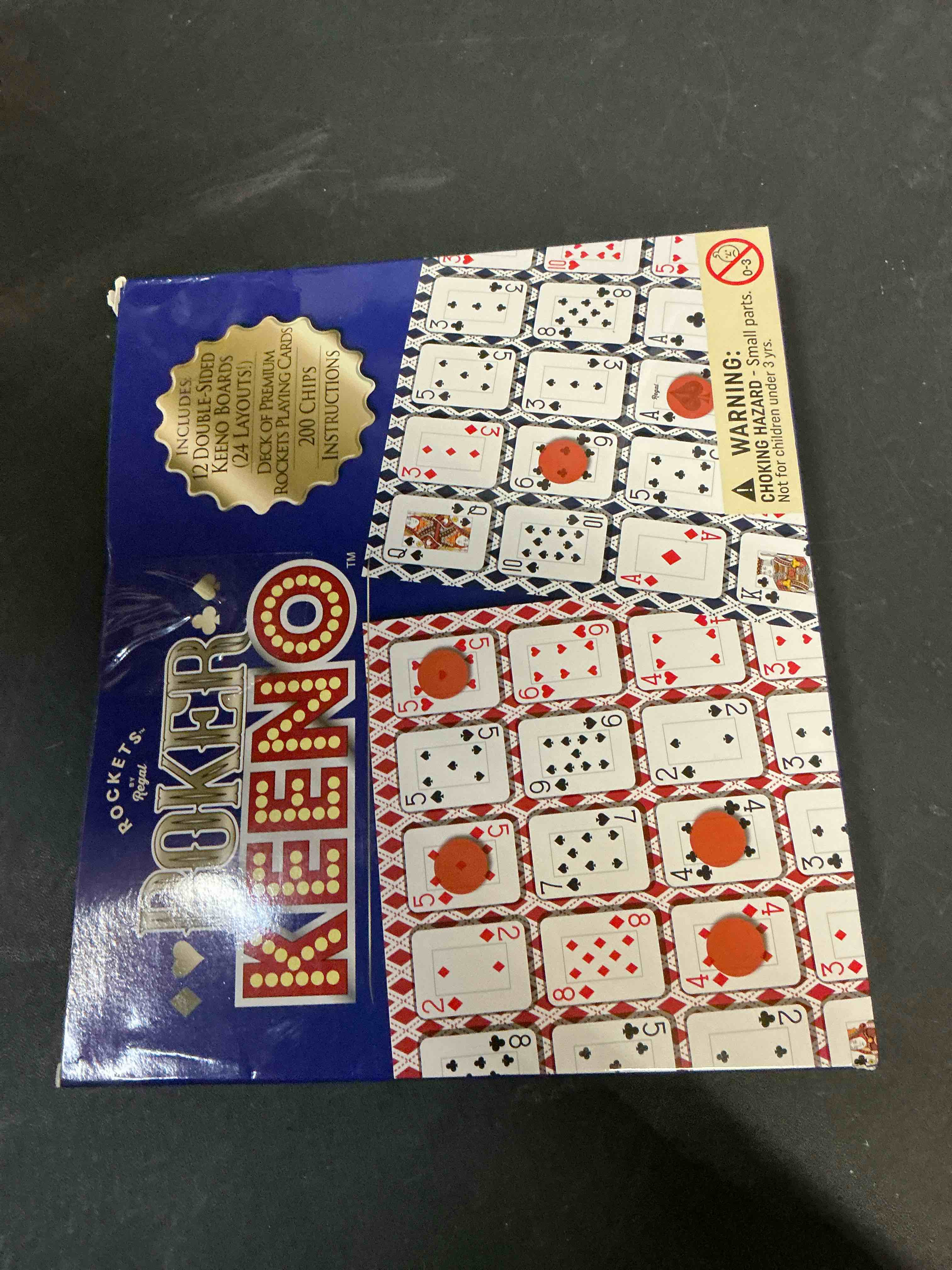 Condition photo showing Good Condition for Regal Games - Poker Keeno Bulk Game Set - Includes 12 Two-Sided Boards, 200 Scoring Chips, 1 Deck of Standard Poker Cards - 24 Unique Board Layouts- Casino Night Card Game- Compatible with Poker Keno