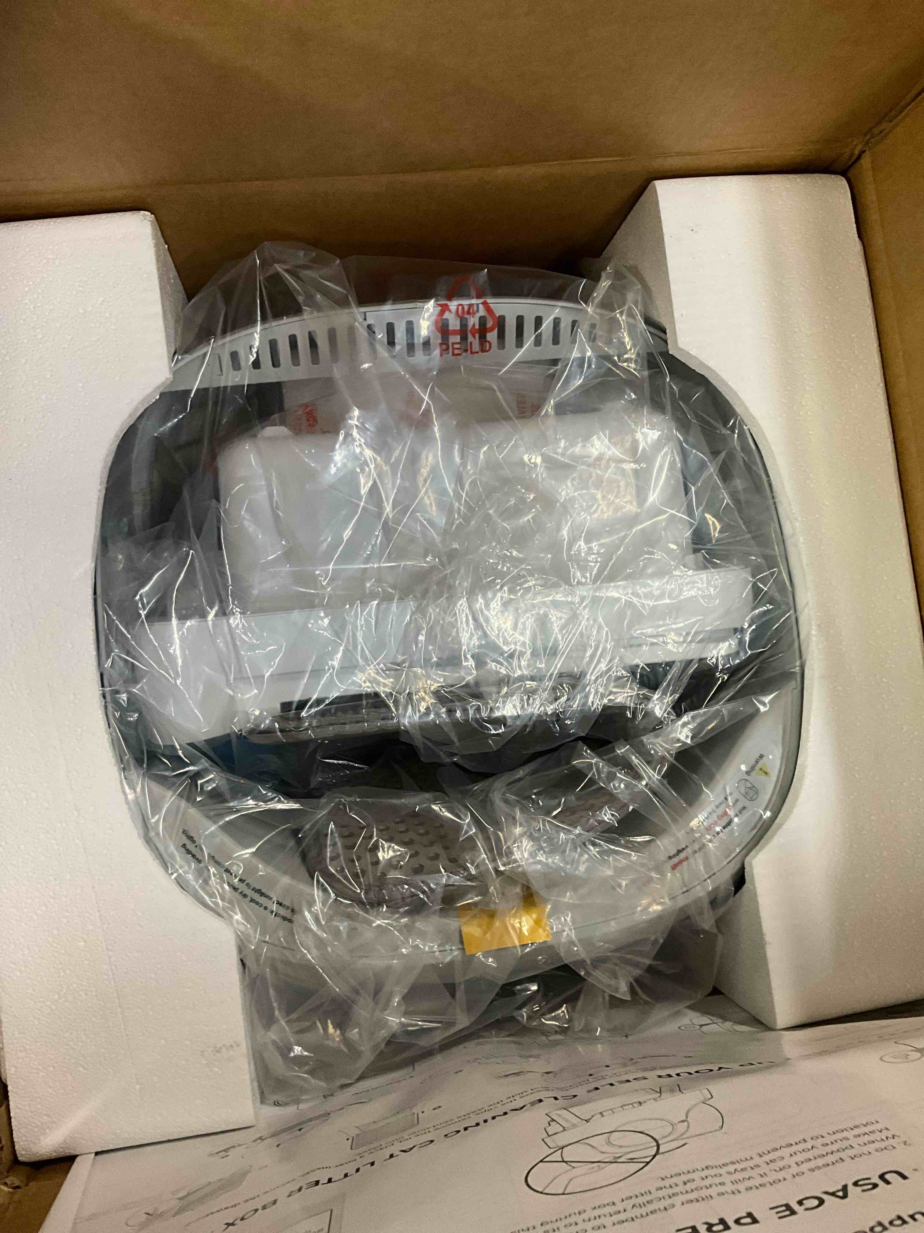Condition photo showing New/Like New for petpivot large open-top automatic cat litter box self cleaning with safety protection mat and trash bags included grey