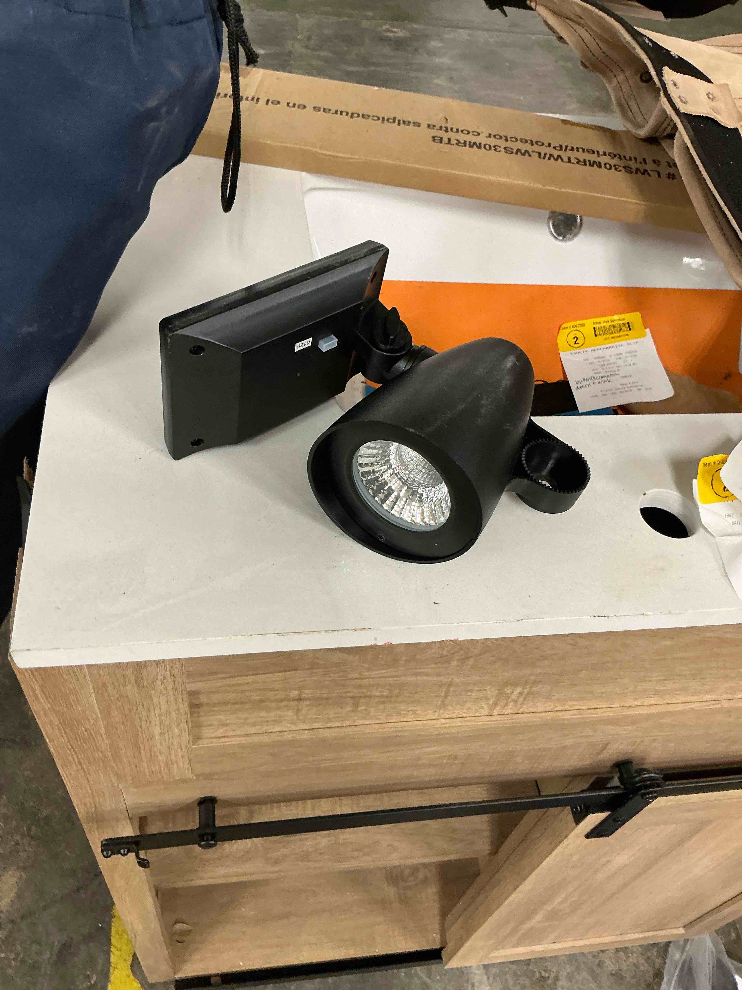 Condition photo showing As Is for harbor breeze 60 -lumens 1 -watt black warm white solar led spot light
