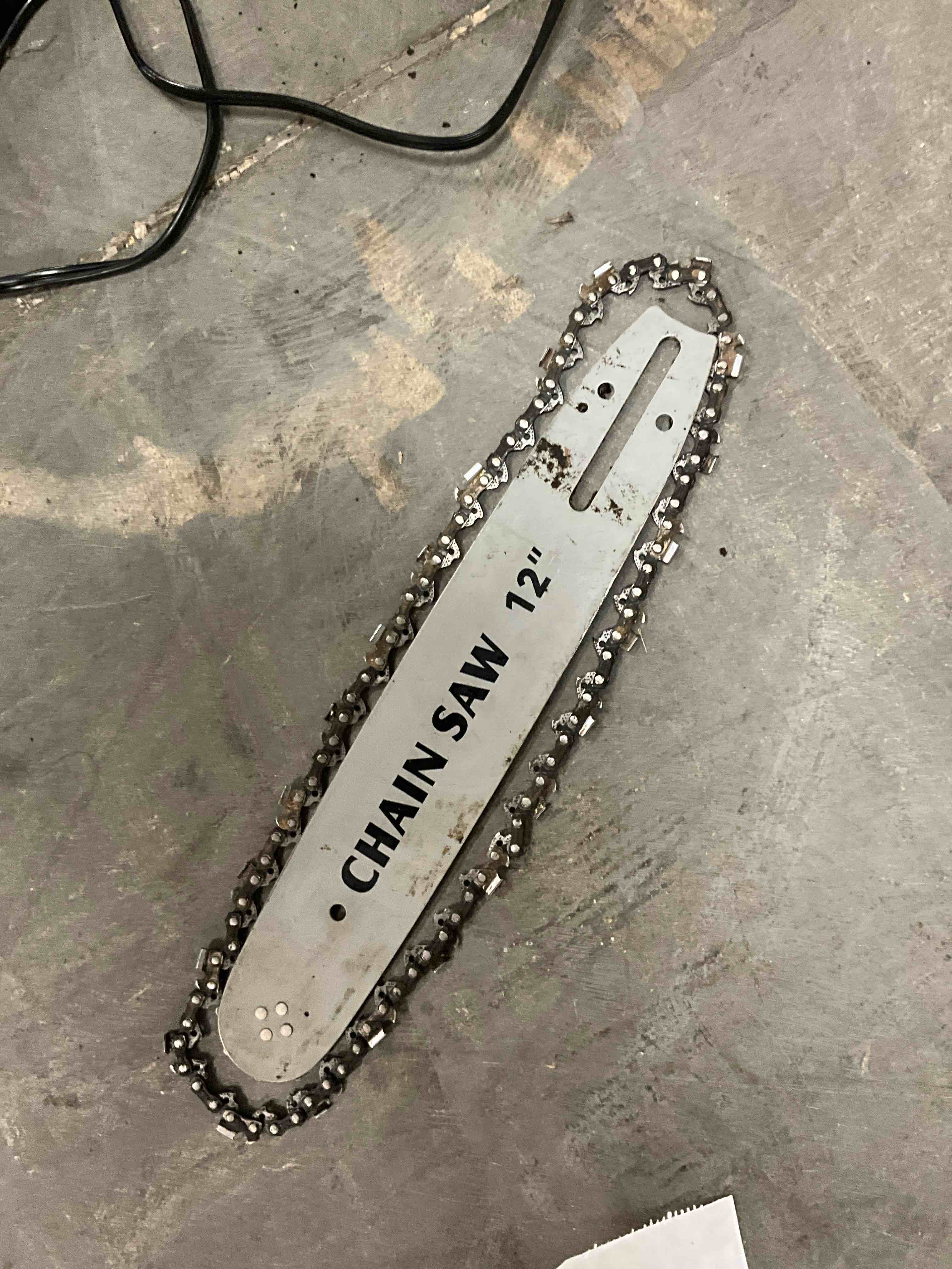 Condition photo showing As Is for 12 inch chainsaw bar & chain combo