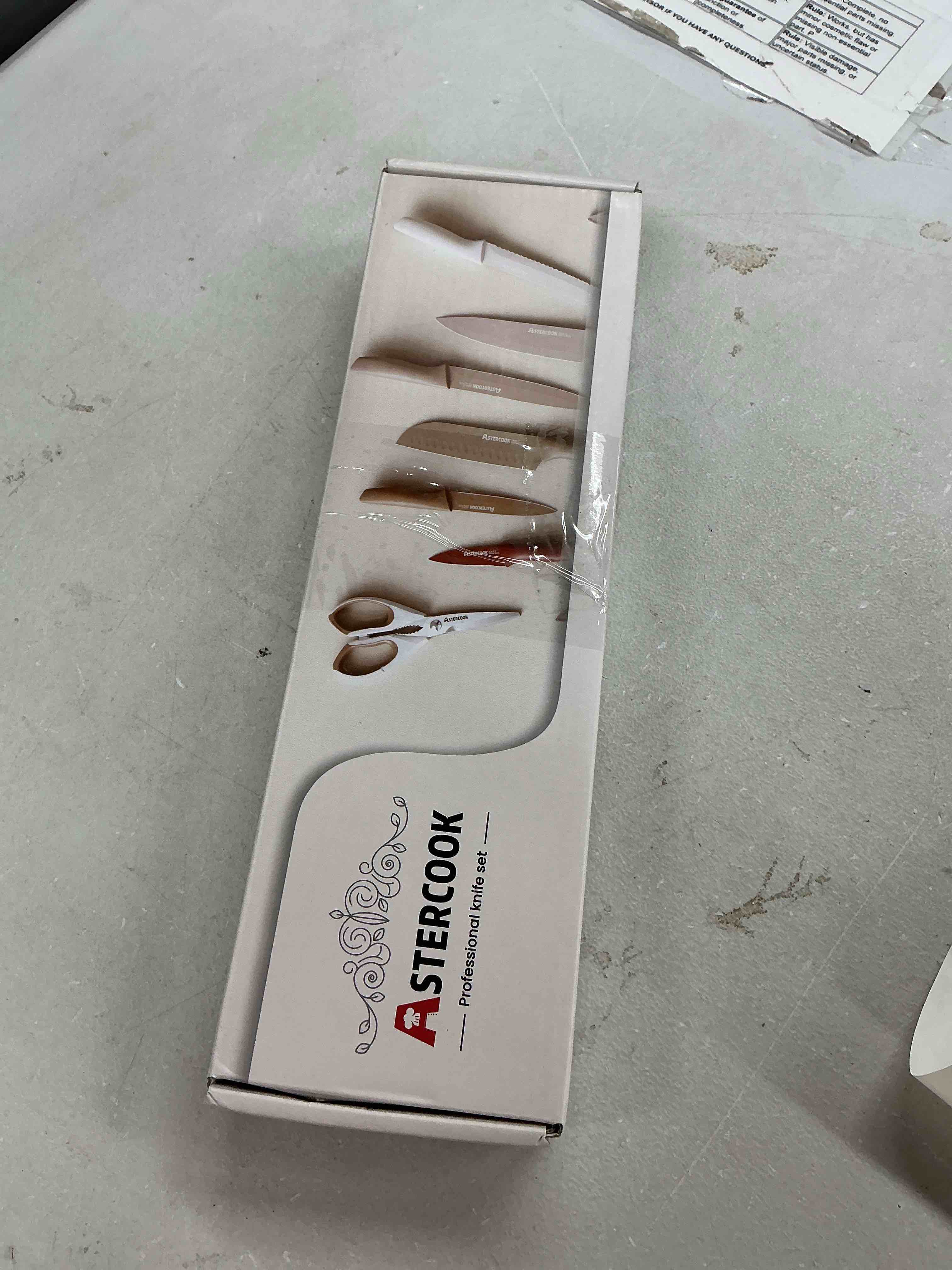 Condition photo showing Good Condition for astercook knife set, 7 pieces kitchen knives set with healthy anti-rust coating, dishwasher safe, stainless steel chef knife sets with 6 blade guards, perfect valentine's day gifts for kitchen cream large
