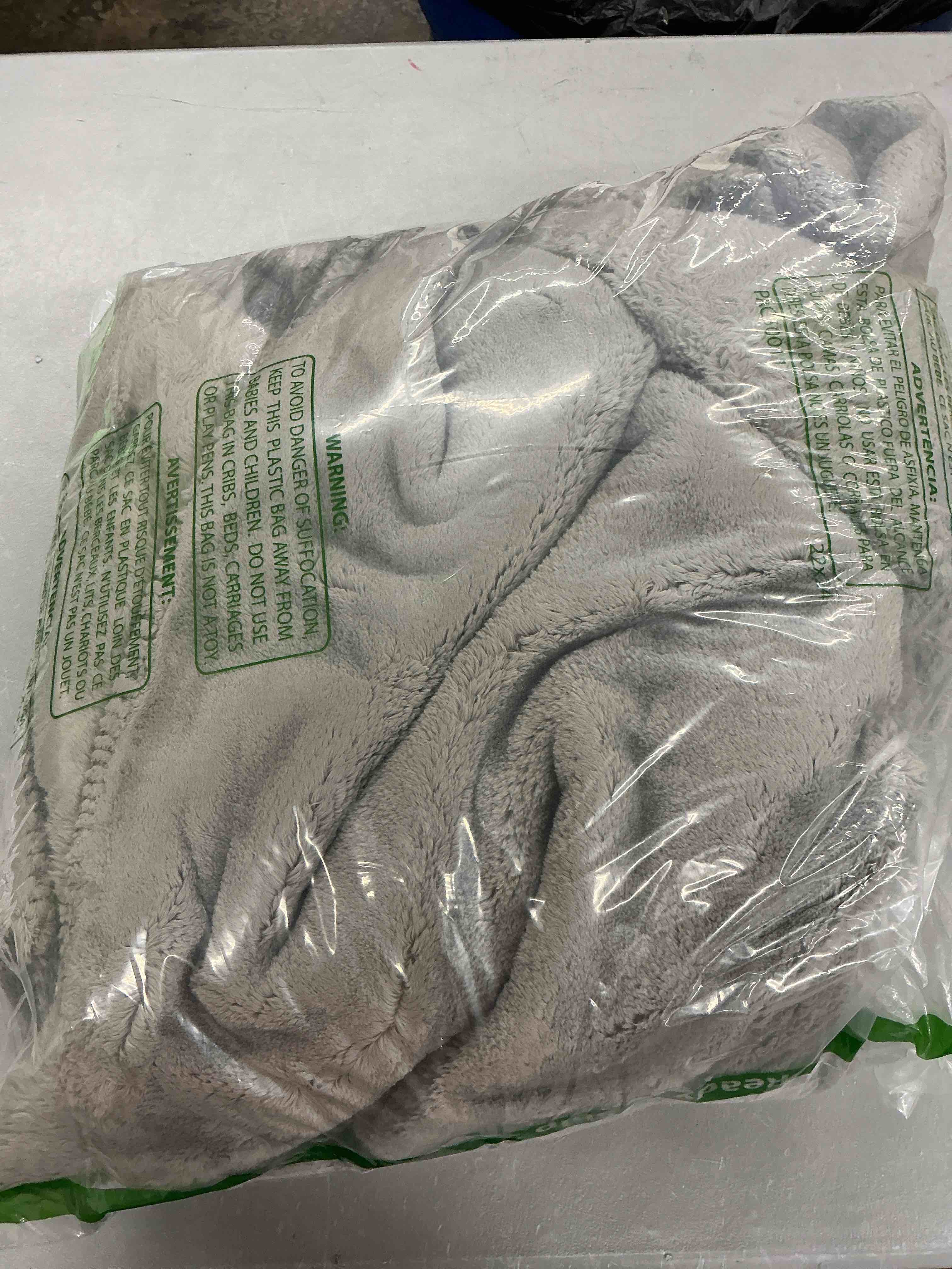 Condition photo showing Good Condition for ugg whitecap fleece throw blanket, soft fluffy blankets for couch or bed, home decor, luxury plush throw, machine washable, 50-inch x 70-inch, light grey seal throw grey