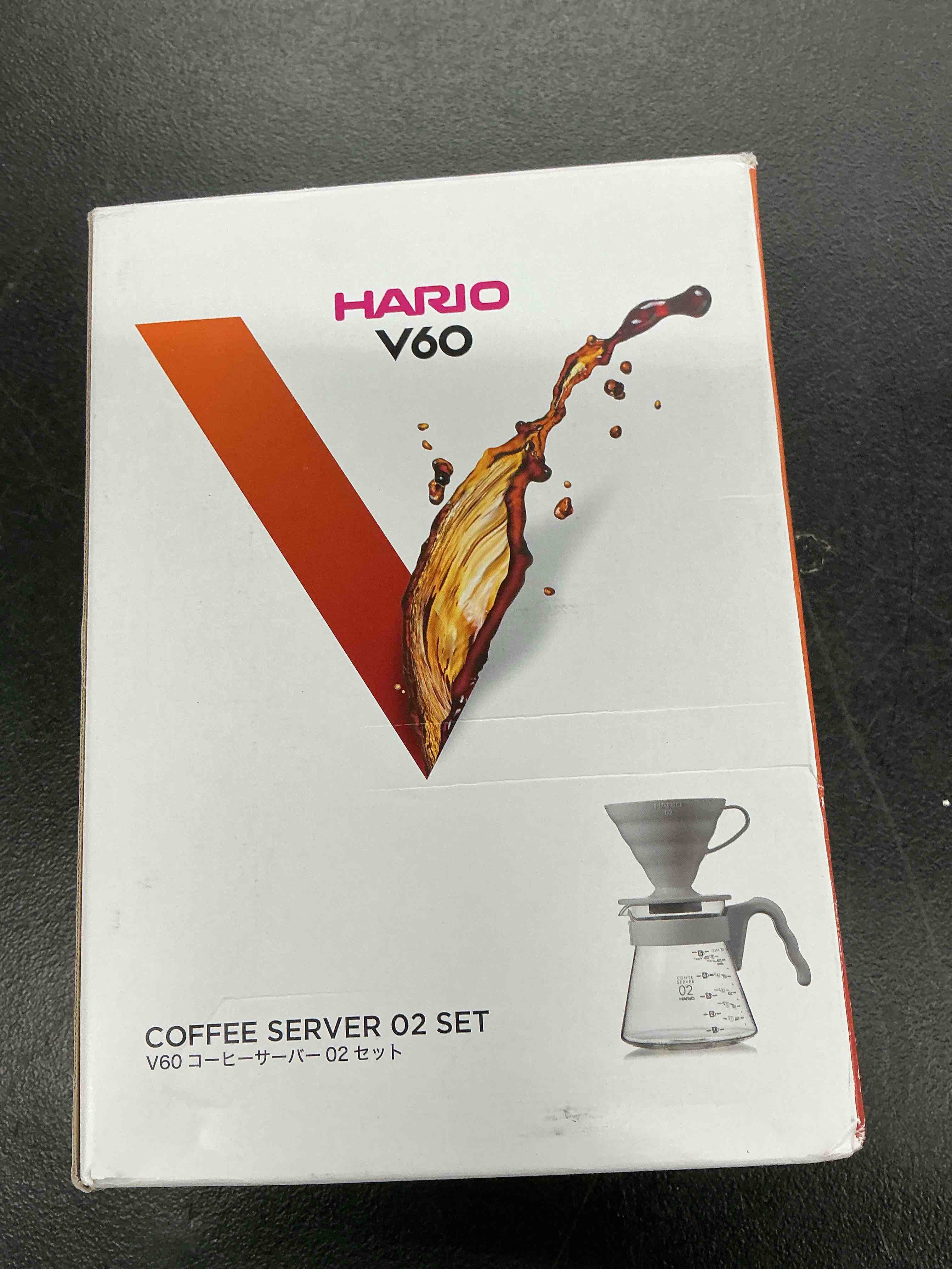 Condition photo showing New/Like New for hario v60 pour over starter set with dripper, glass server, scoop and filters, size 02, pale grey