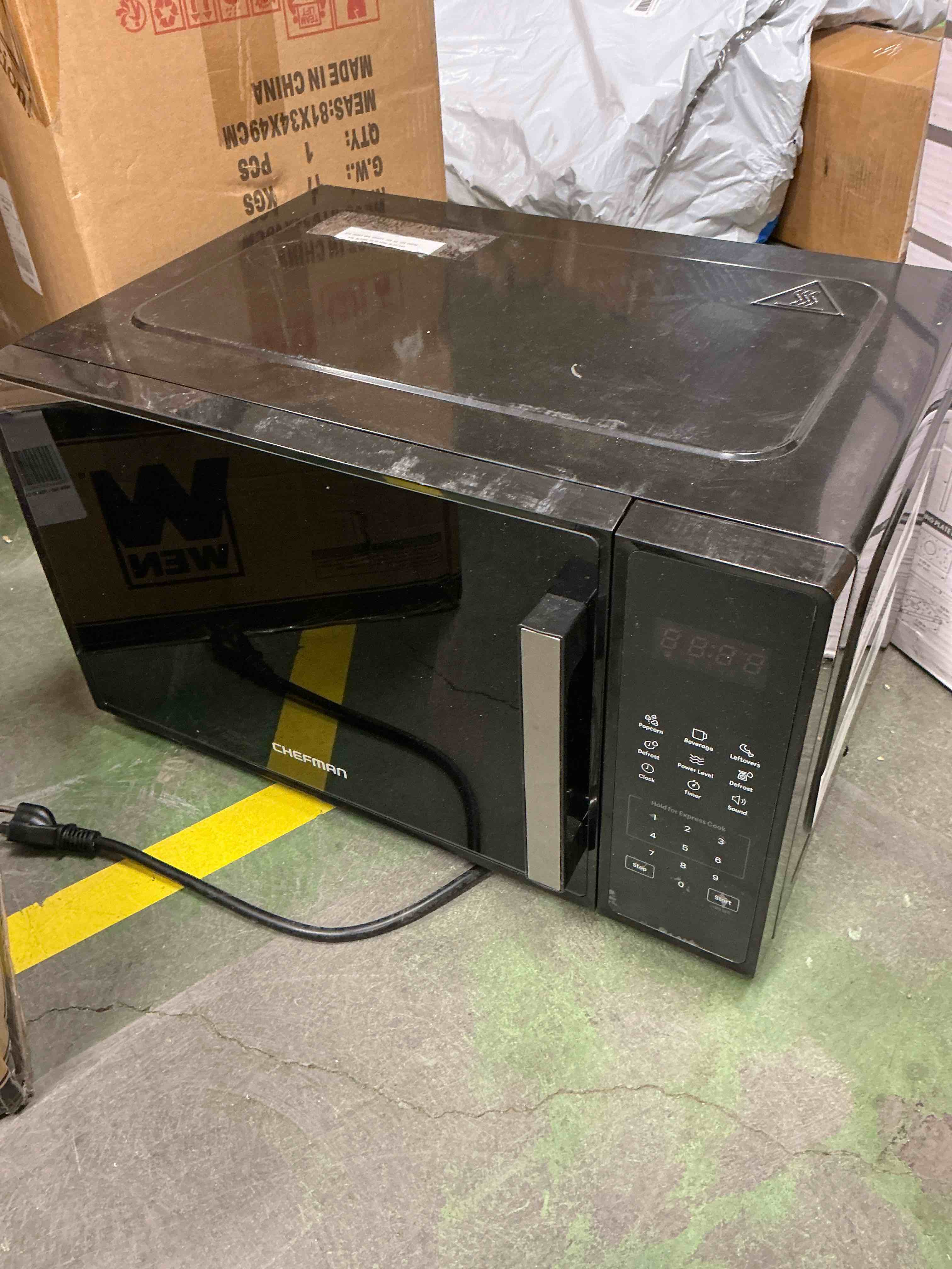 Condition photo showing Good Condition for Chefman Countertop Microwave Oven 0.7 Cu. Ft., 700 Watts with 3 Presets and 10 Power Levels - Black