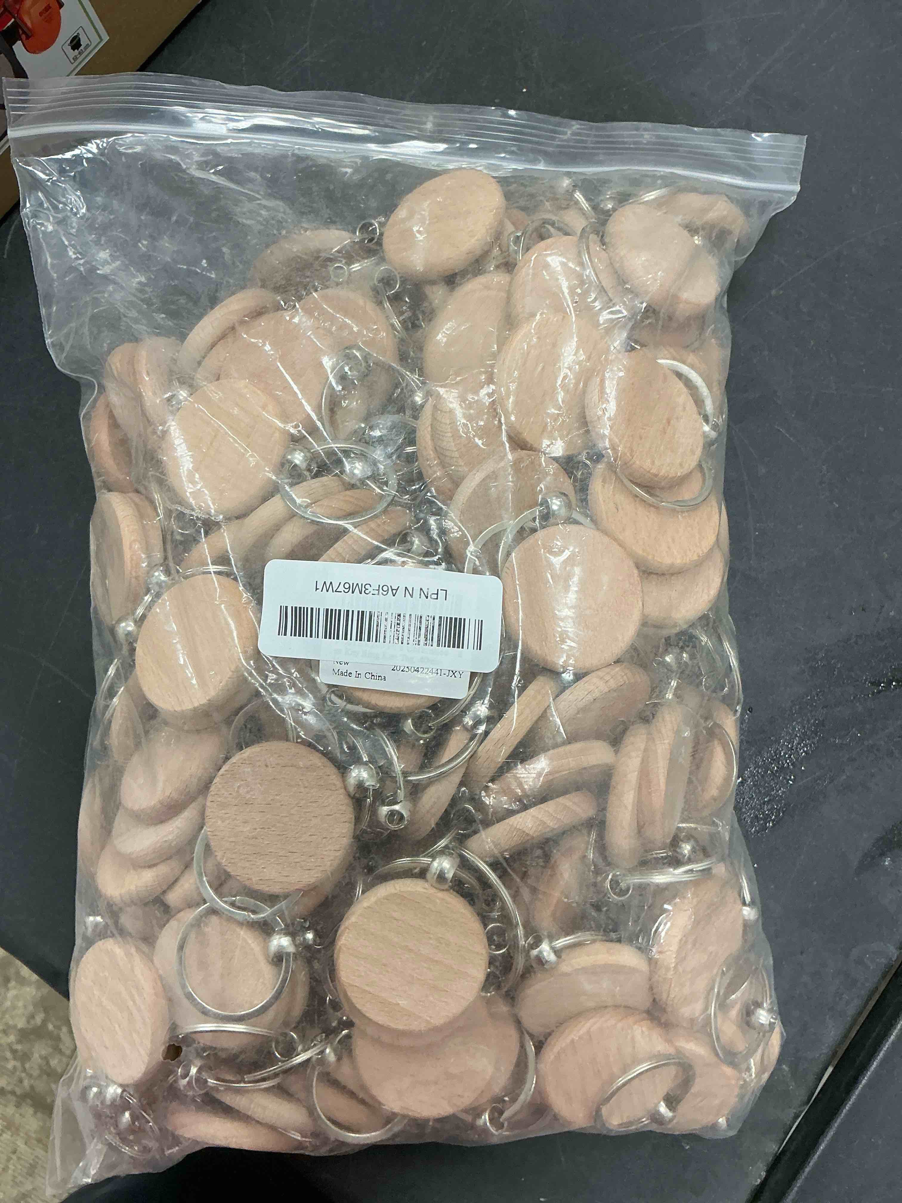 Condition photo showing New/Like New for JUXYES 200 PCS Unfinished Wooden Keychain Blanks for Engraving, Wood Engraving Blanks Key Chain, DIY Round Wood Keychain Tags Unfinished Wooden Key Ring Key Tag, 40mm