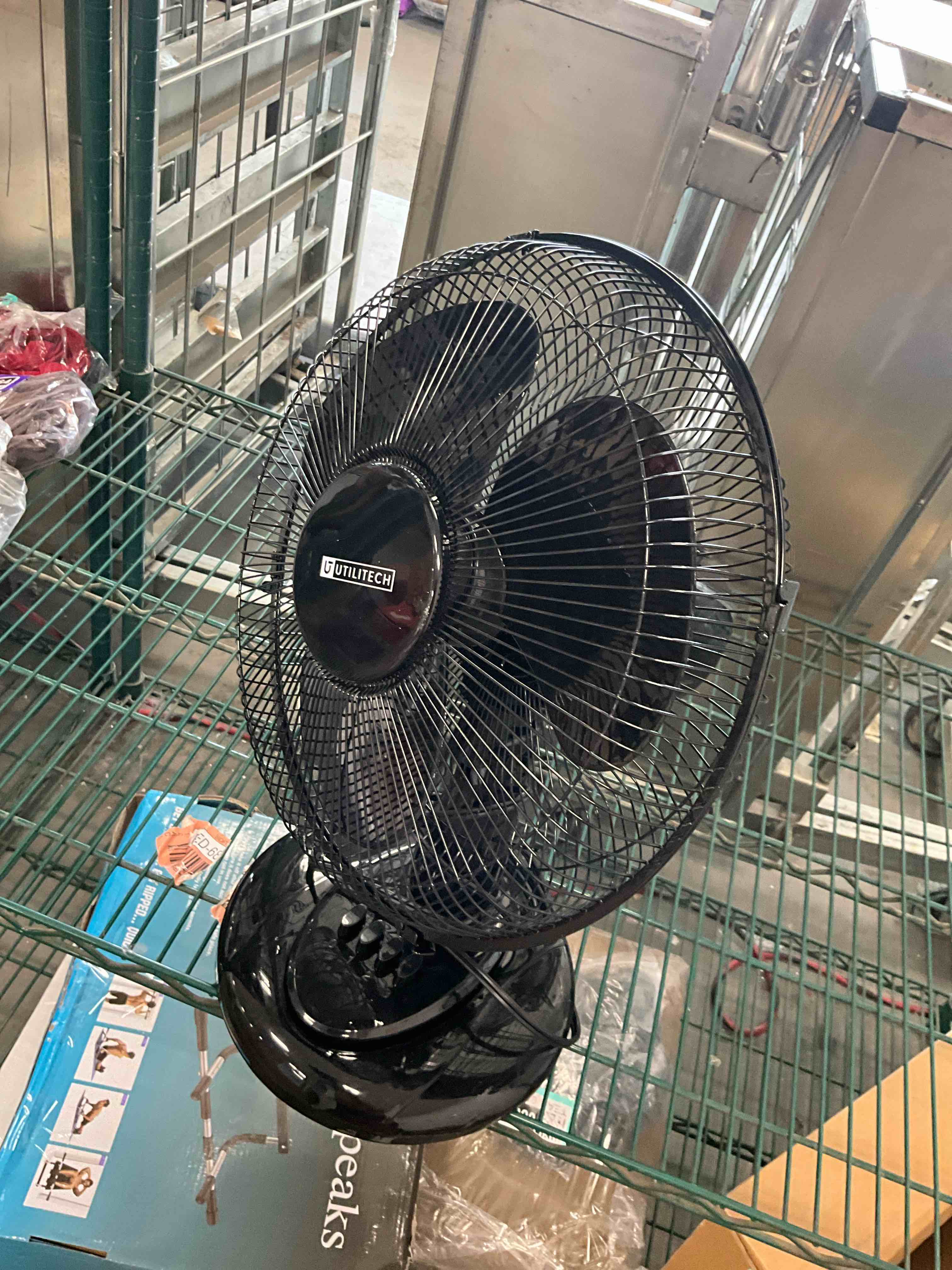 Condition photo showing Good Condition for  utilitech 12-in indoor oscillating desk fan, in black