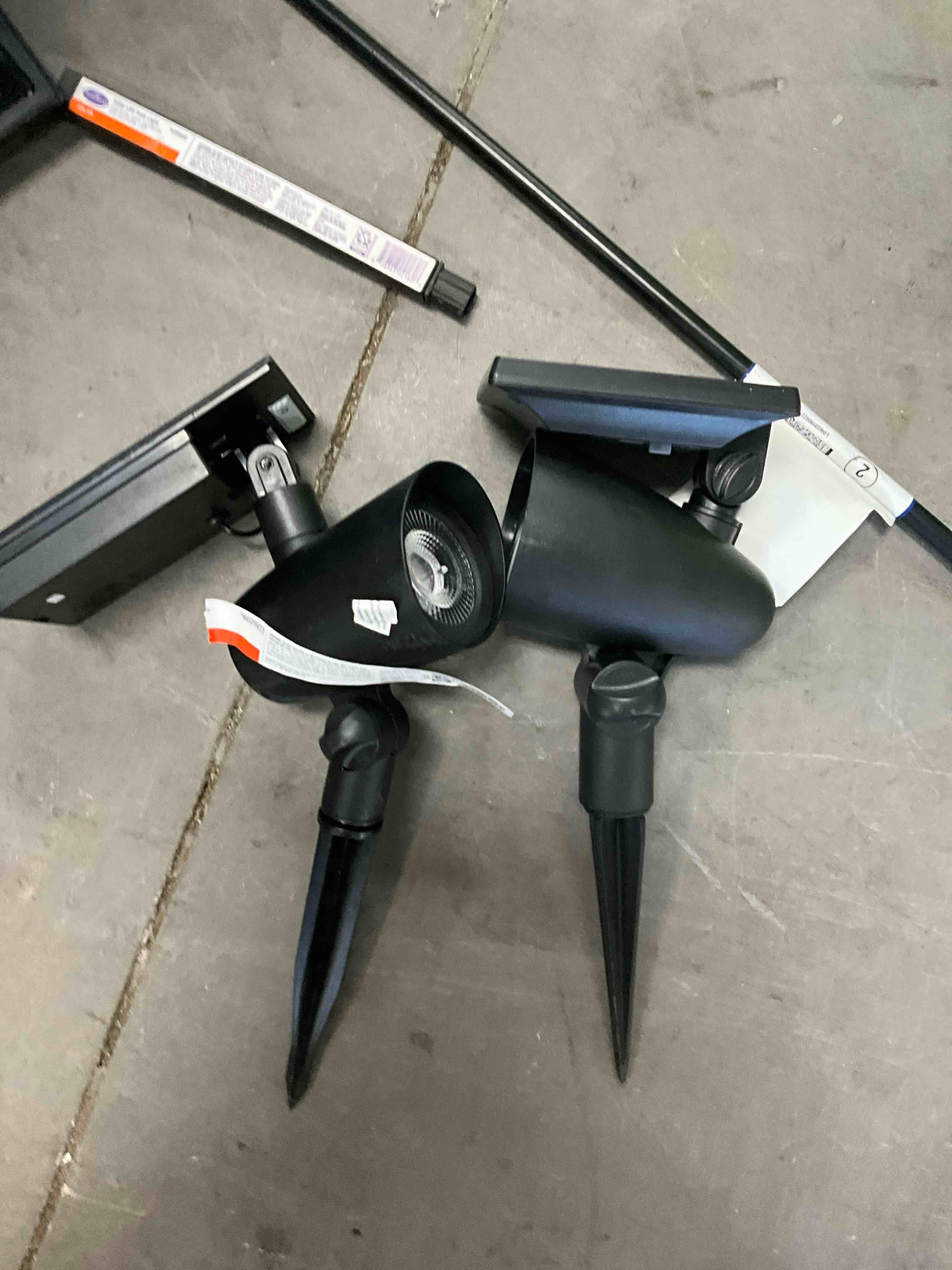 Condition photo showing Good Condition for 2 solar lights including harbor breeze 180 -lumens black warm white solar led flood light