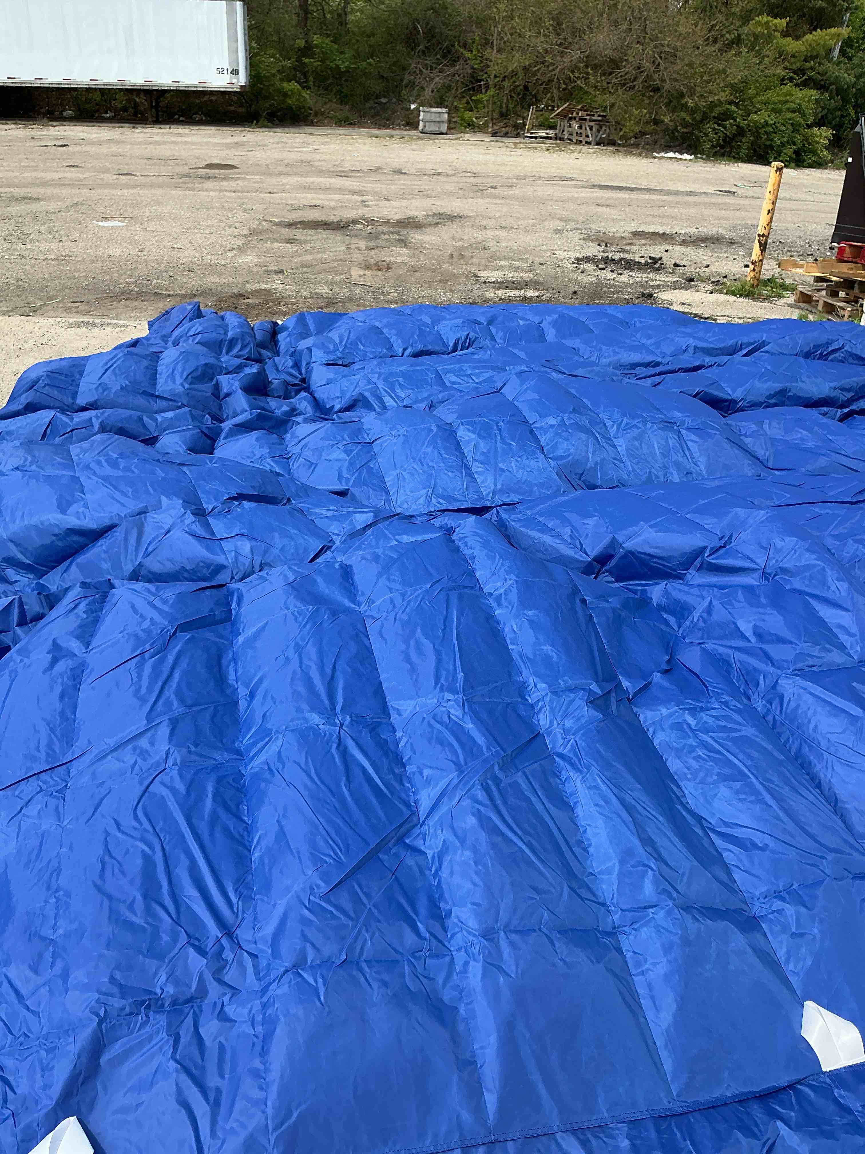 Condition photo showing As Is for puff 50" x 60" down alternative indoor/outdoor water resistant packable throw, electric blue