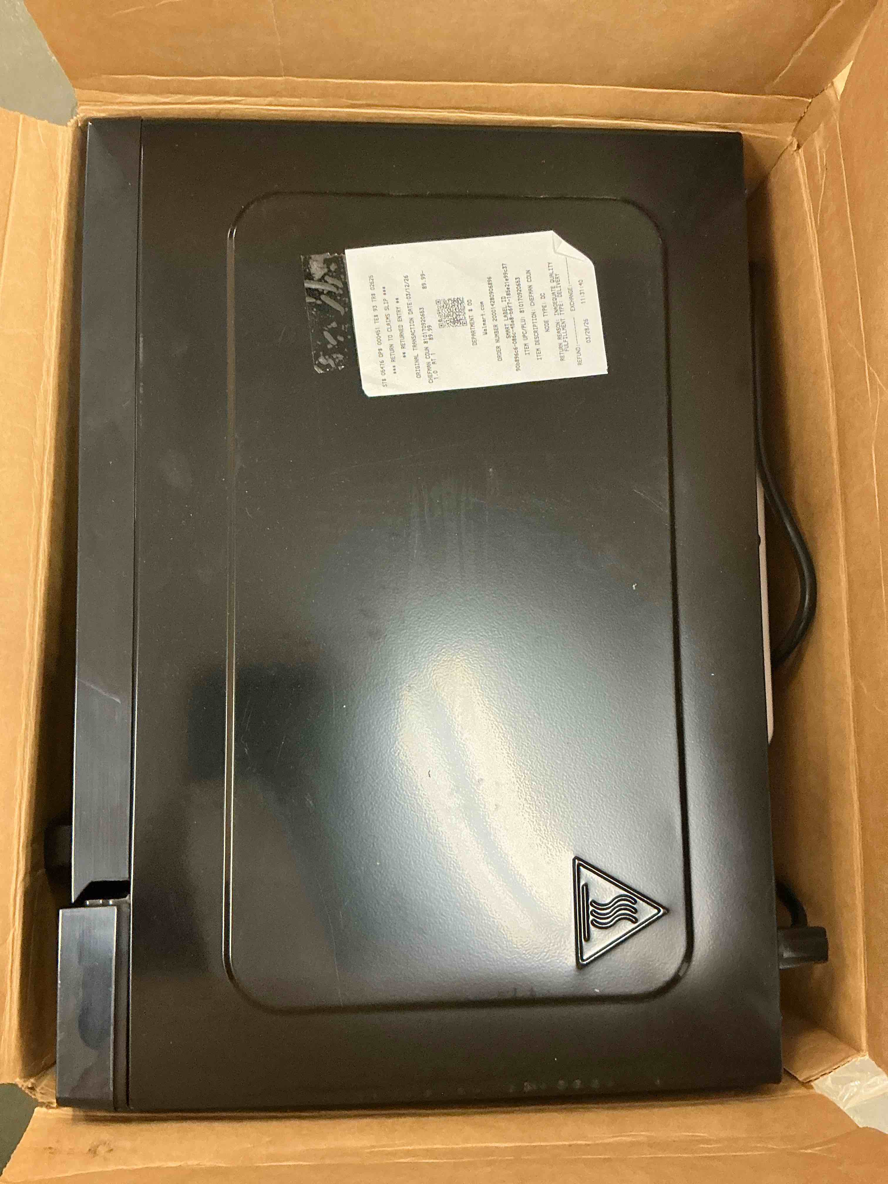 Condition photo showing As Is for chefman countertop microwave oven 1.1 cu. ft., 1000 watts with 6 presets and 10 power levels - black