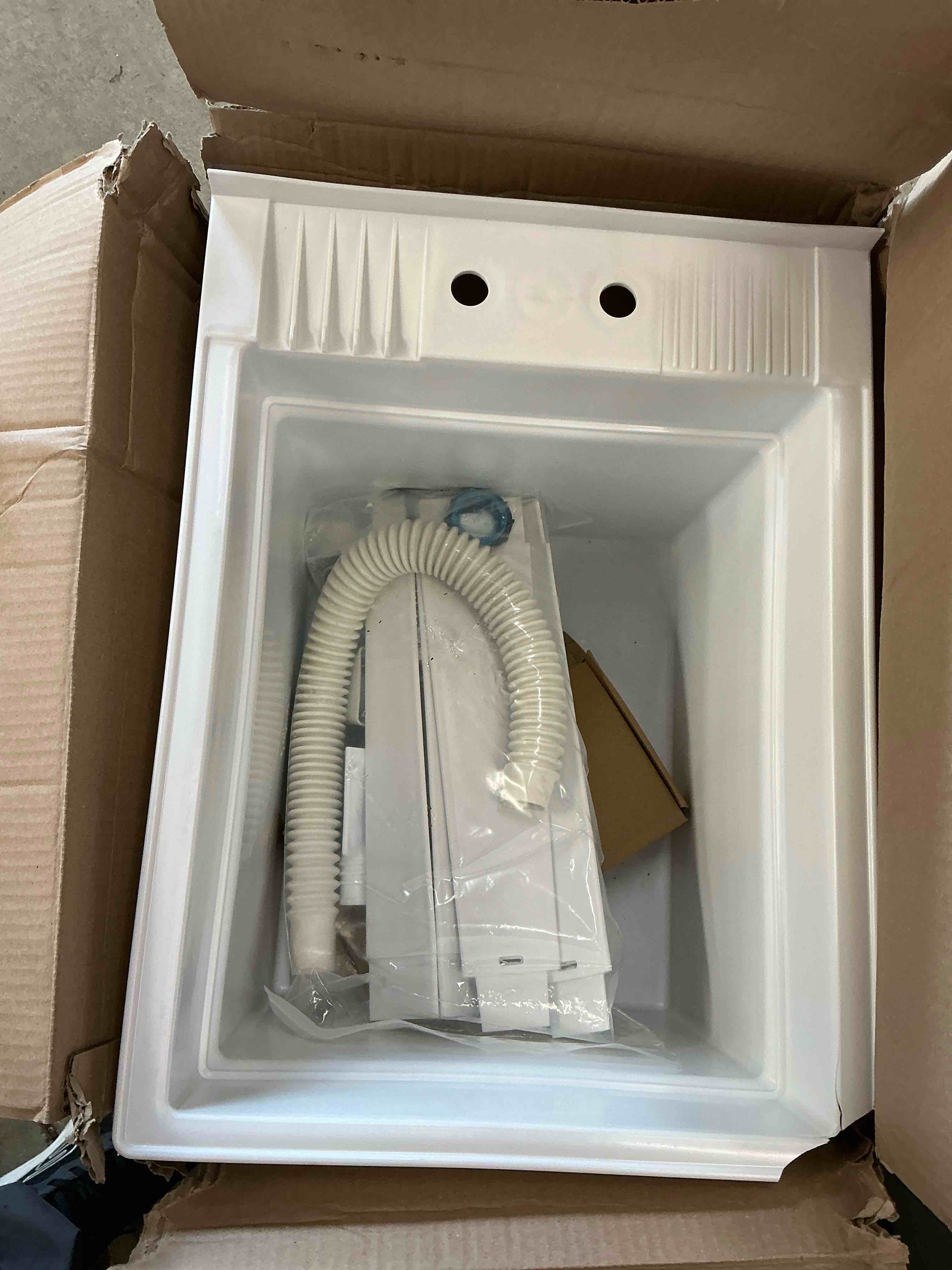 Condition photo showing As Is for project source 18-in x 24-in 1 -basin white freestanding utility tub with drain with faucet