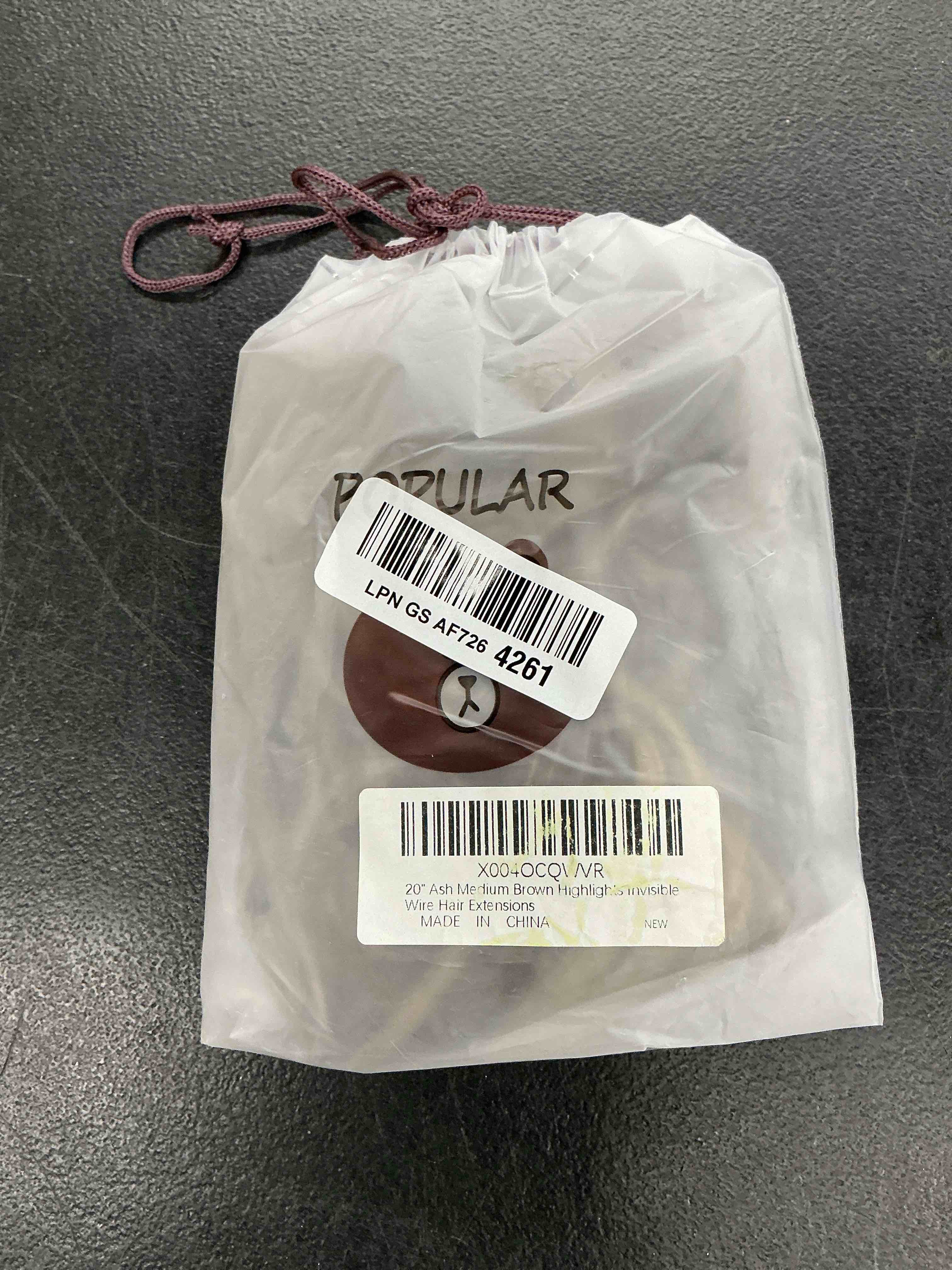 Condition photo showing Good Condition for medium brown halo hair extensions with ash blonde highlights | 20 inch wavy synthetic fiber with invisible wire and 4 secure clips for easy daily styling and party wear