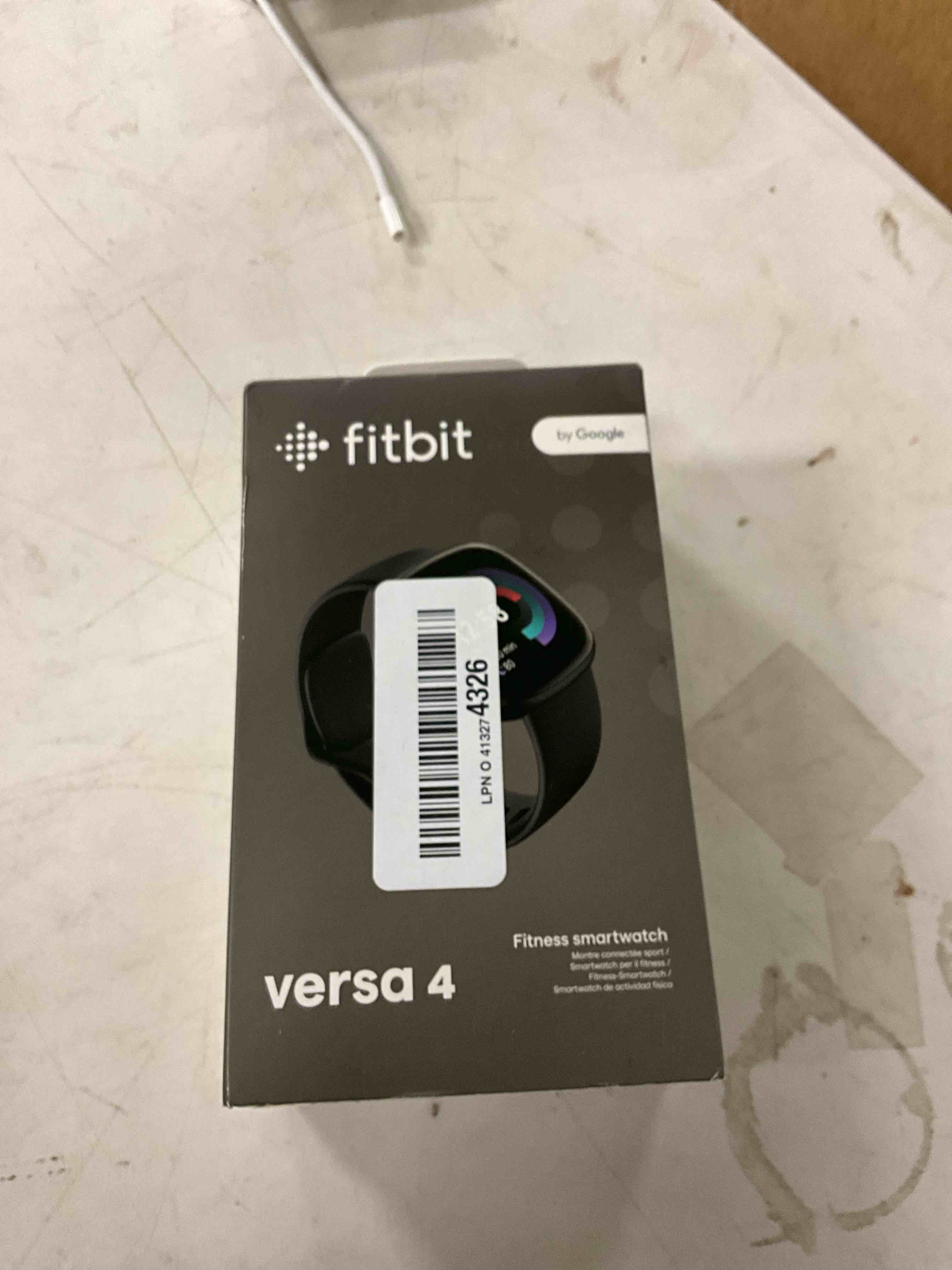 Condition photo showing New/Like New for Fitbit Versa 4 Fitness Smartwatch with Daily Readiness, GPS, 24/7 Heart Rate, 40+ Exercise Modes, Sleep Tracking and more, Black/Graphite, One Size (S & L Bands Included)
