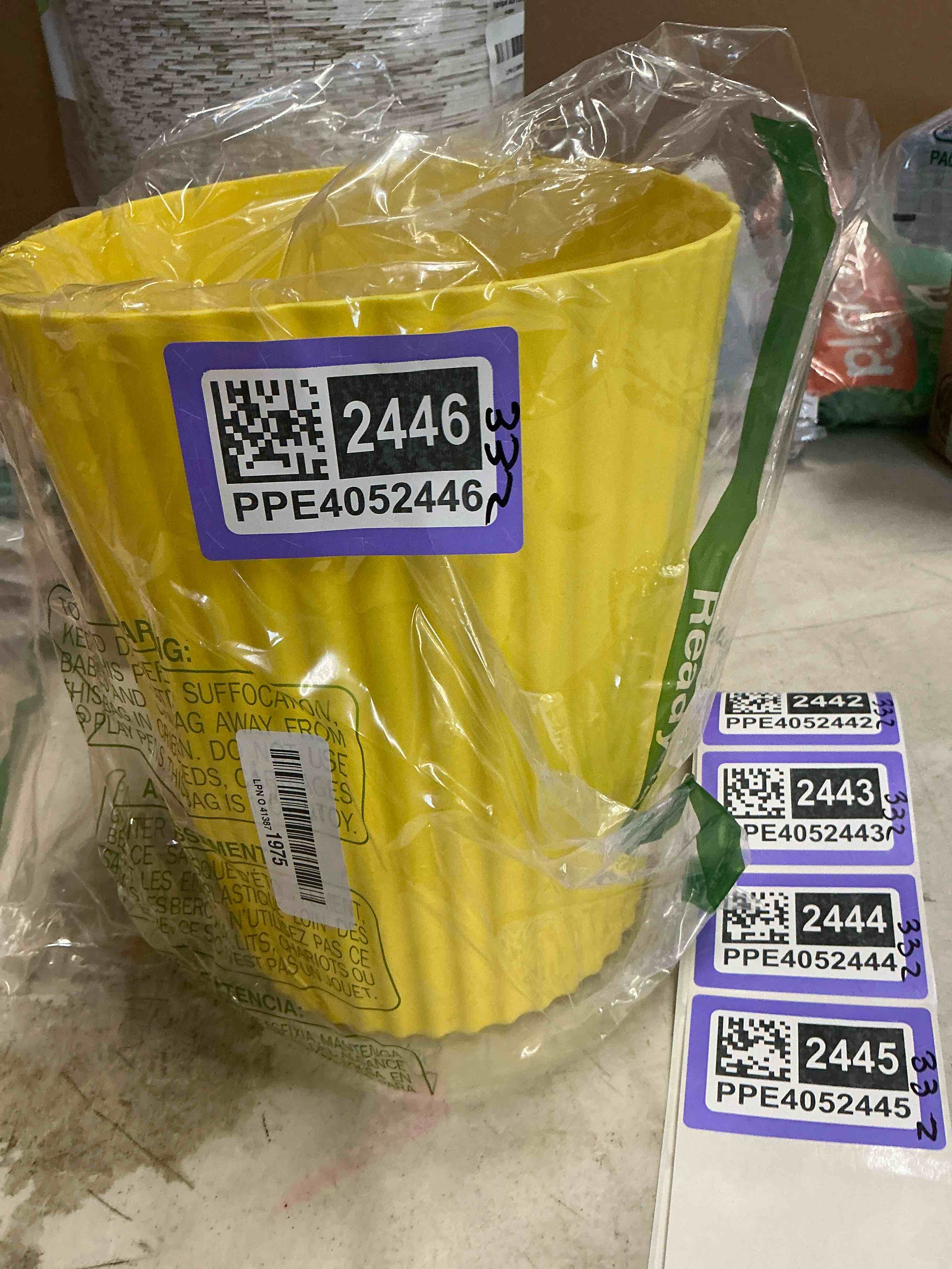 Small yellow trashcan