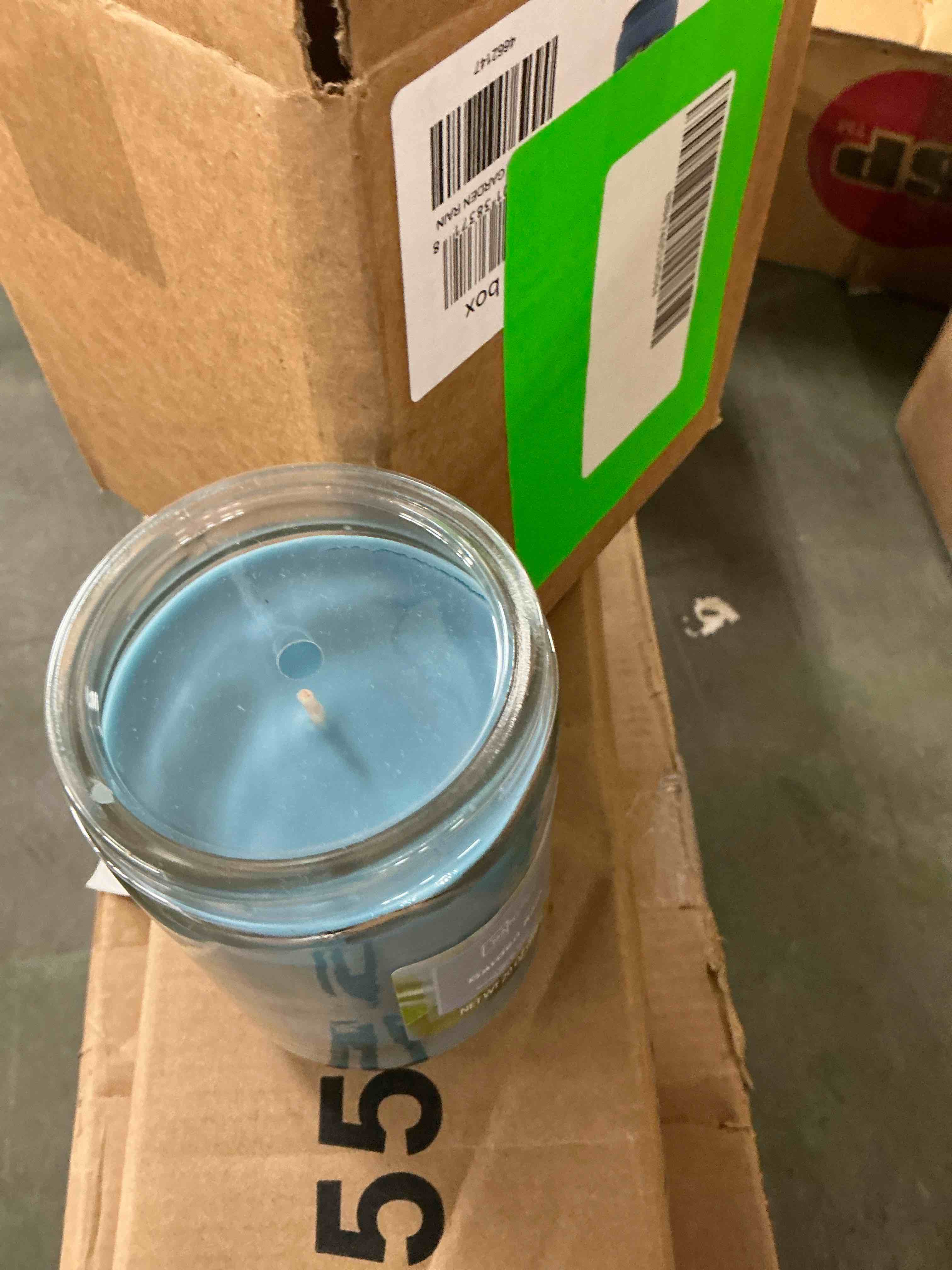 Condition photo showing New/Like New for mainstays single-wick scented glass jar candle garden rain 20oz.