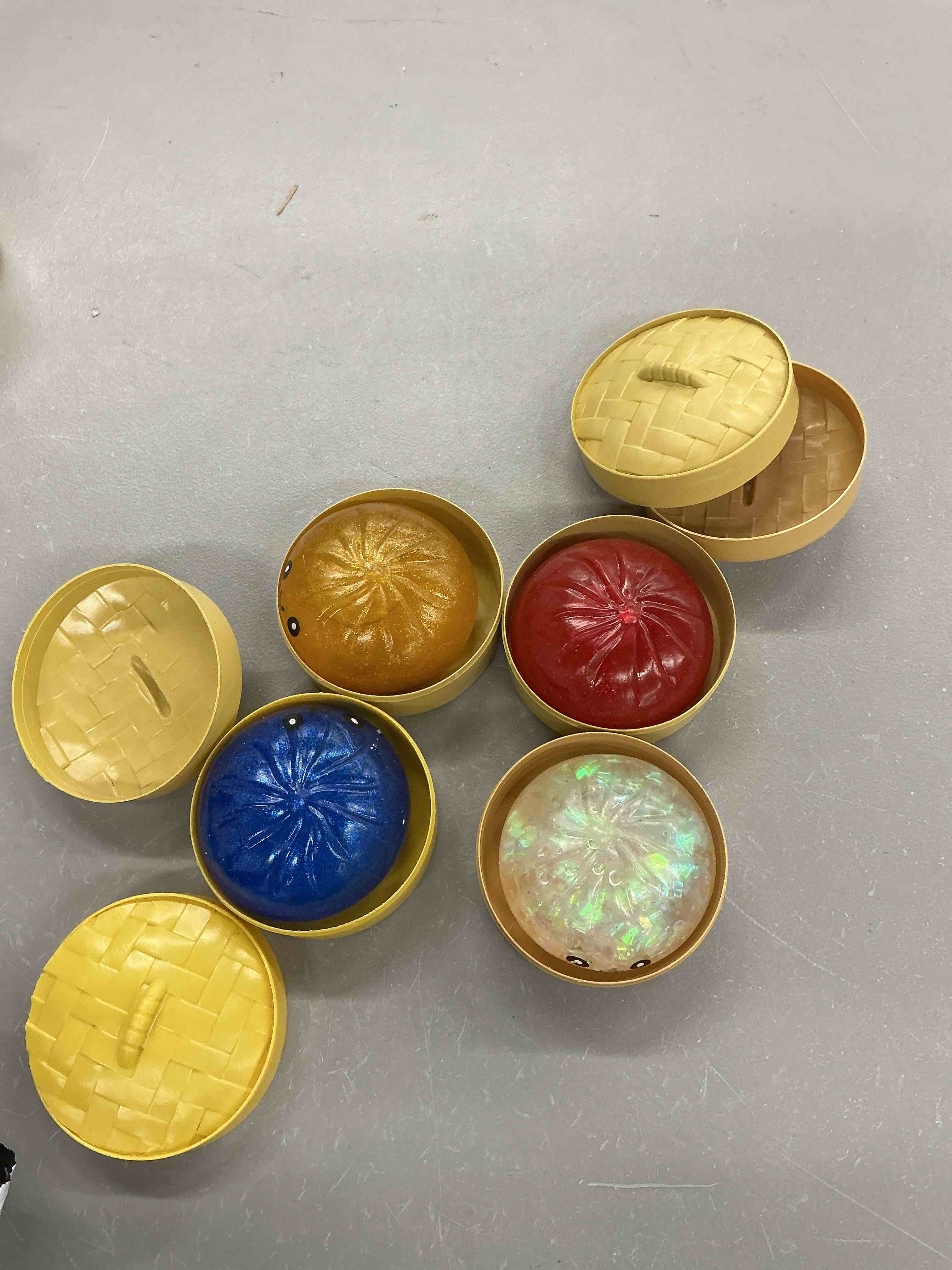 Condition photo showing Good Condition for 4pcs glitter dumpling squishy box, dumpling squishies, sensory squeeze toy for stress relief, soft decompression dough for adults office and home use (gold glitter + blue + red + transparent ribbon)