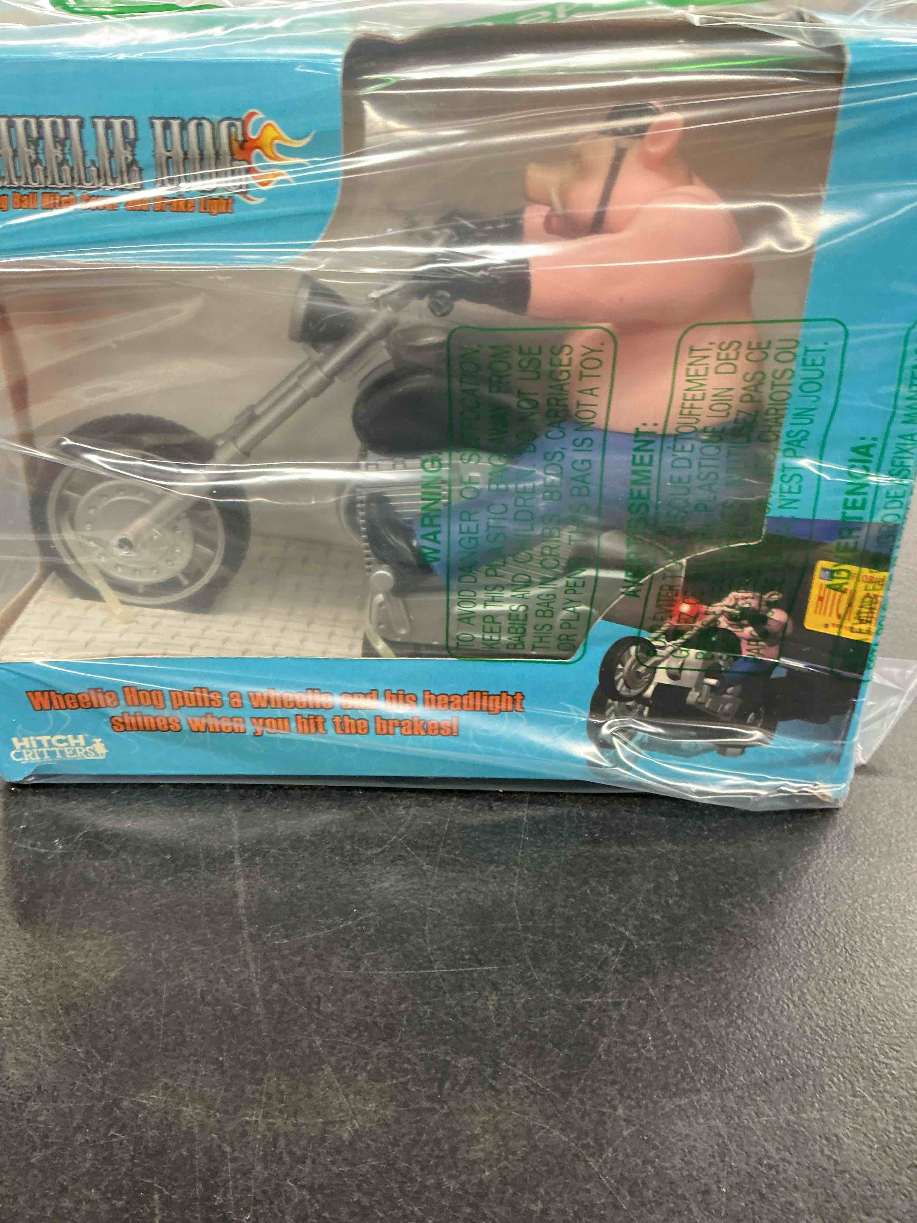 Condition photo showing New/Like New for 1032 wheelie hog animated ball hitch cover and brake light