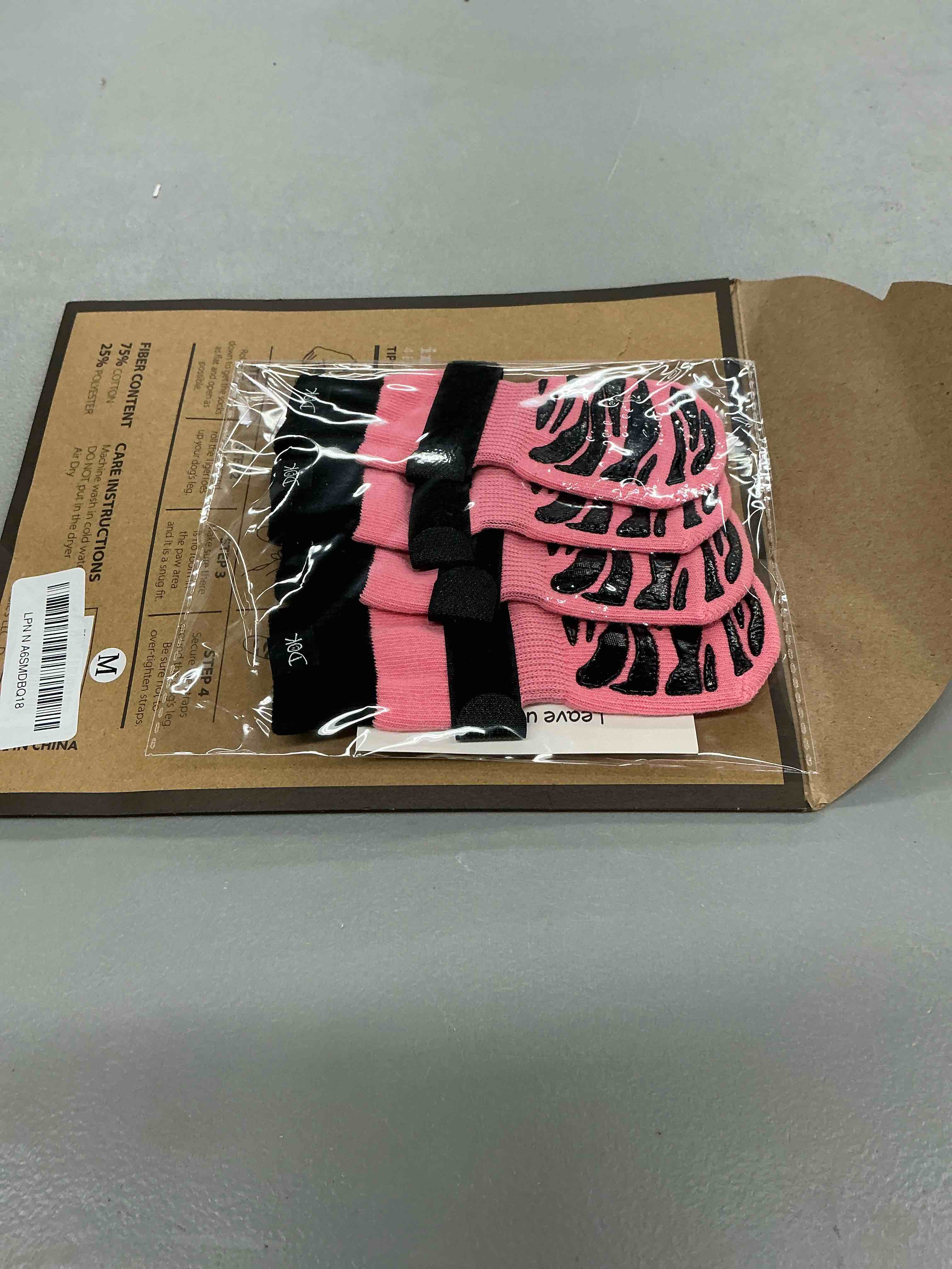 Condition photo showing New/Like New for dok tigertoes premium non-slip dog socks for hardwood floors - extra-thick grip that works even when twisted - prevents licking, slipping, and great for dog paw protection (sassy pink, medium) sassy pink medium