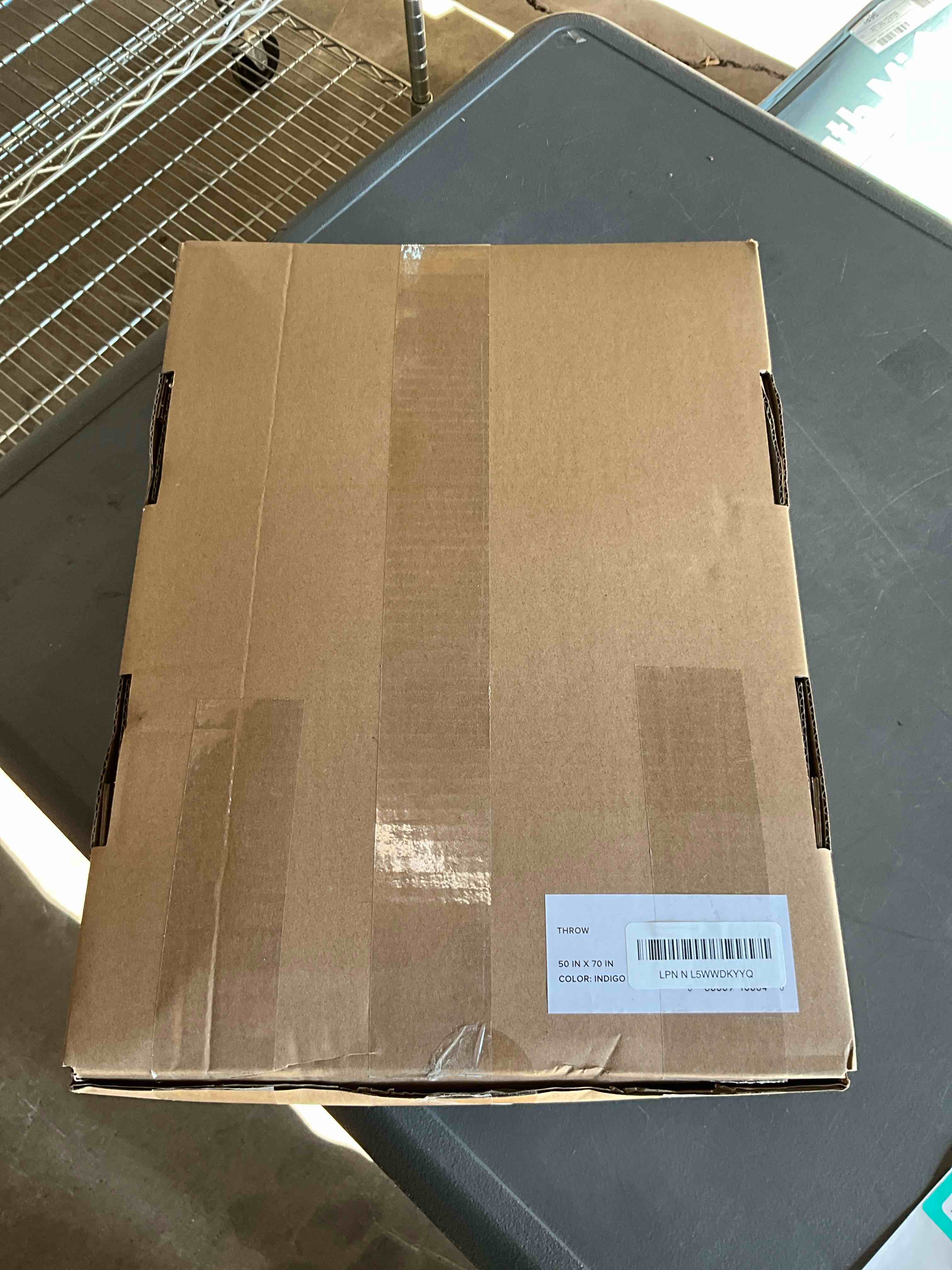 Condition photo showing New/Like New for UGG Euphoria Faux Fur Throw Blanket, Soft Warm Throw Blankets for Couch or Bed, Luxury Bedroom Decor, Giftable Fuzzy Blankets, Machine Washable, 50-inch x 70-inch, Indigo Blue Blue Throw