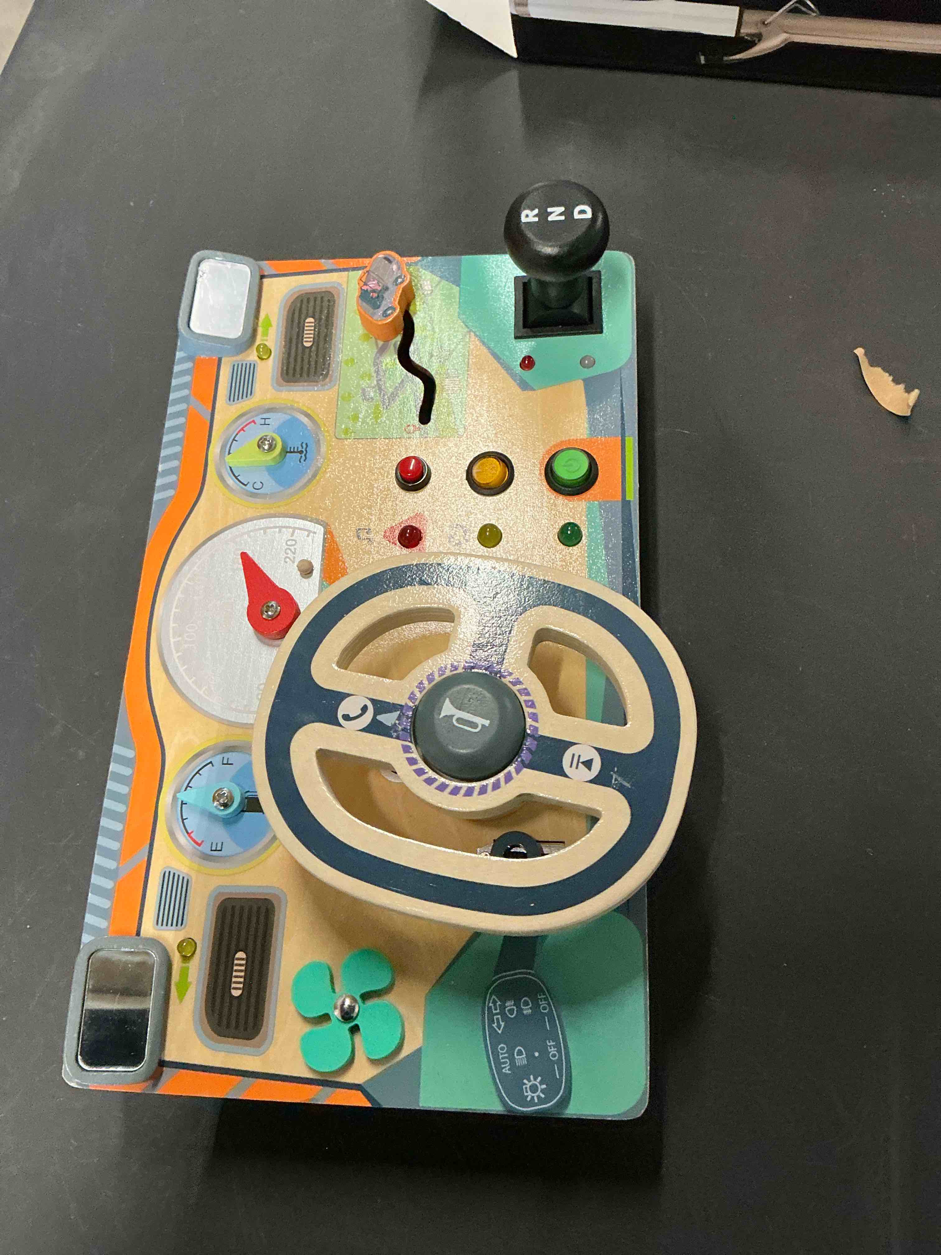 Condition photo showing Good Condition for Busy Board Montessori Toys for 1 2 3 Year Old, Wooden Toddler Sensory Toy Busy Board with LED Lights Sound Switch, Toddlers Activity Travel Toy, Steering Wheel Toddler Toys Christmas Gift for Boy Girl