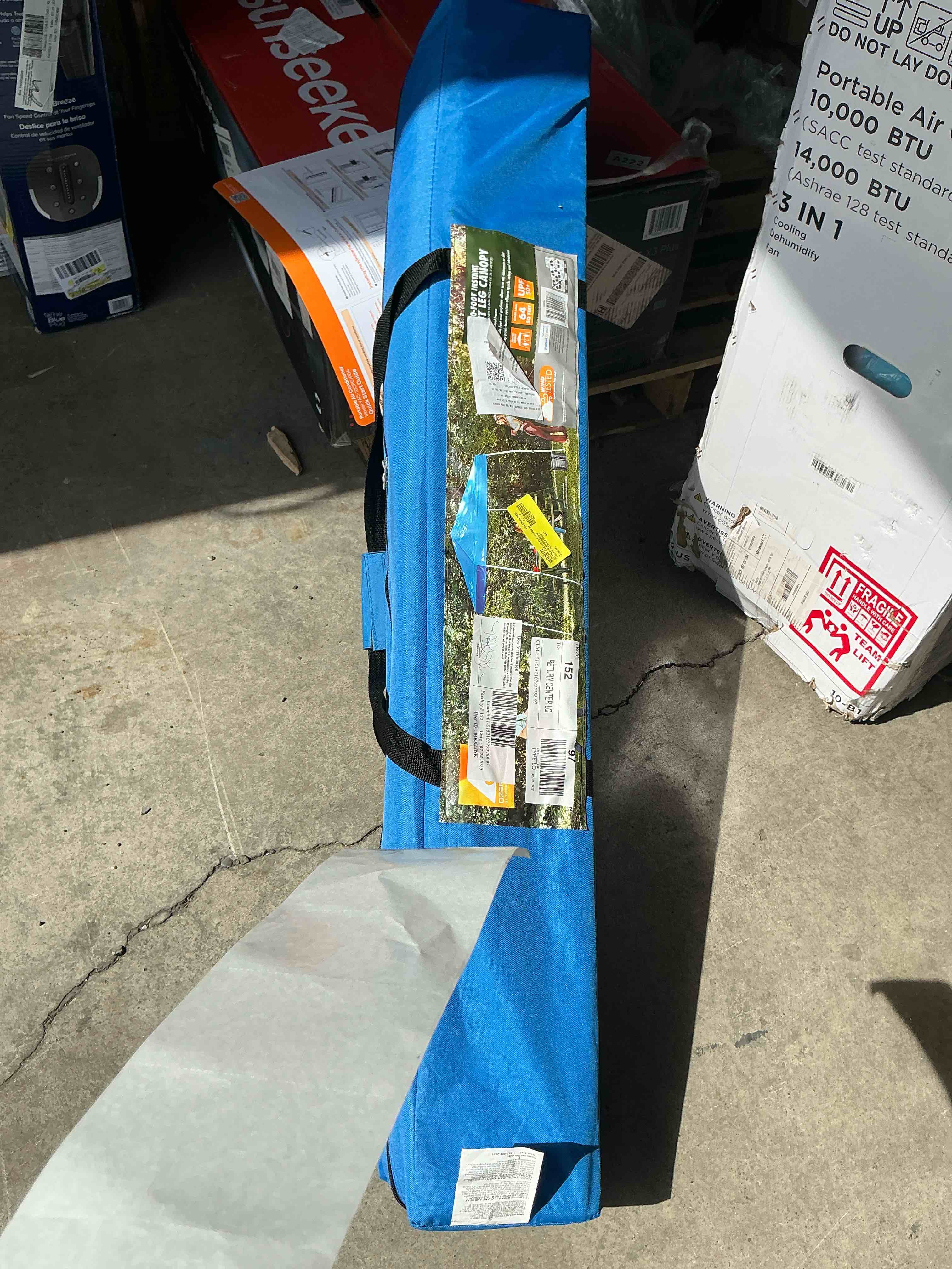 Condition photo showing Good Condition for ozark trail 10' x 10' instant slant leg pop-up outdoor canopy, blue