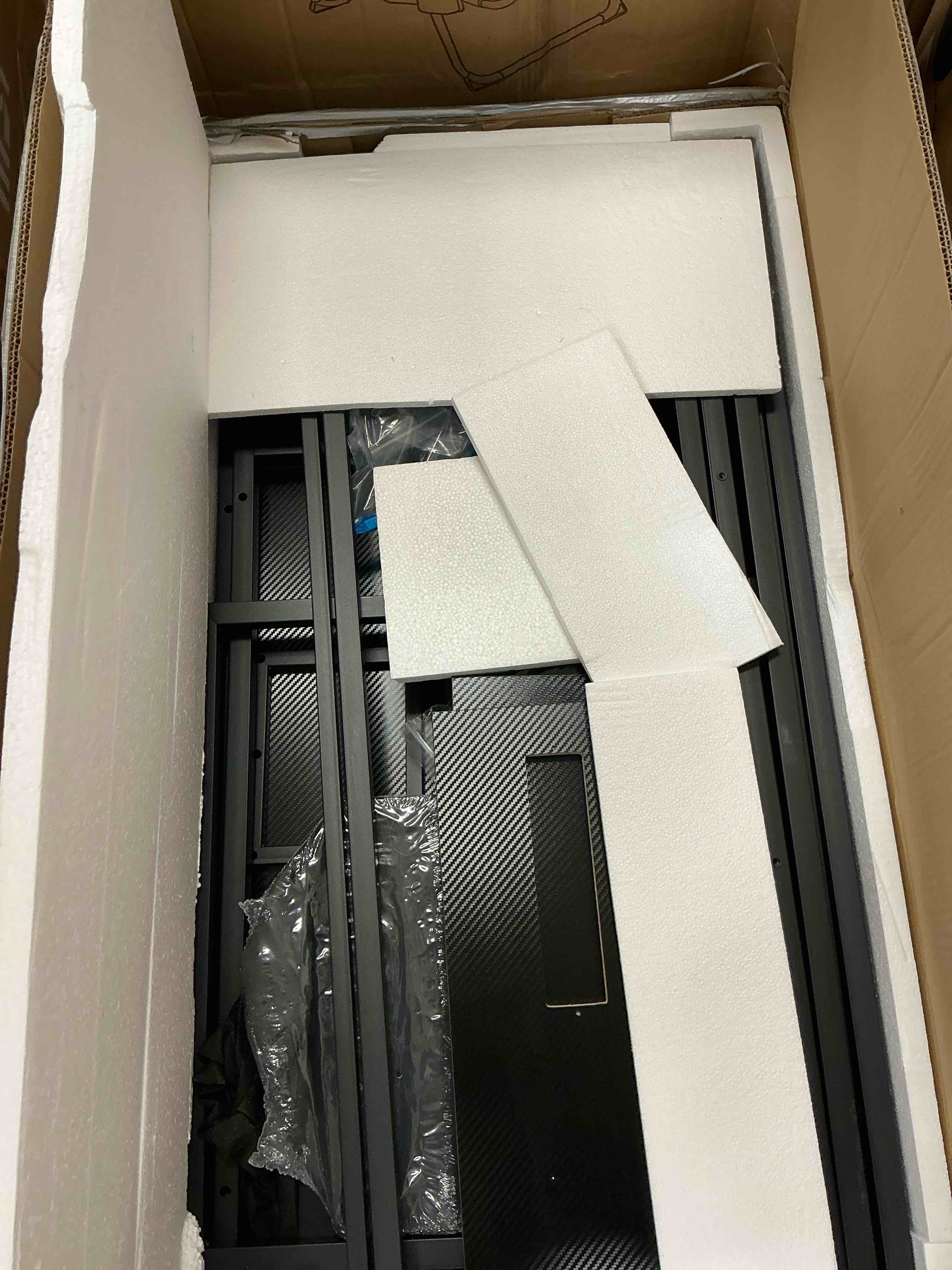 Condition photo showing New/Like New for gunaito 60 inch gaming desk with 5 fabric drawers & storage shelves, computer desk with led lights & charging station, carbon fiber black