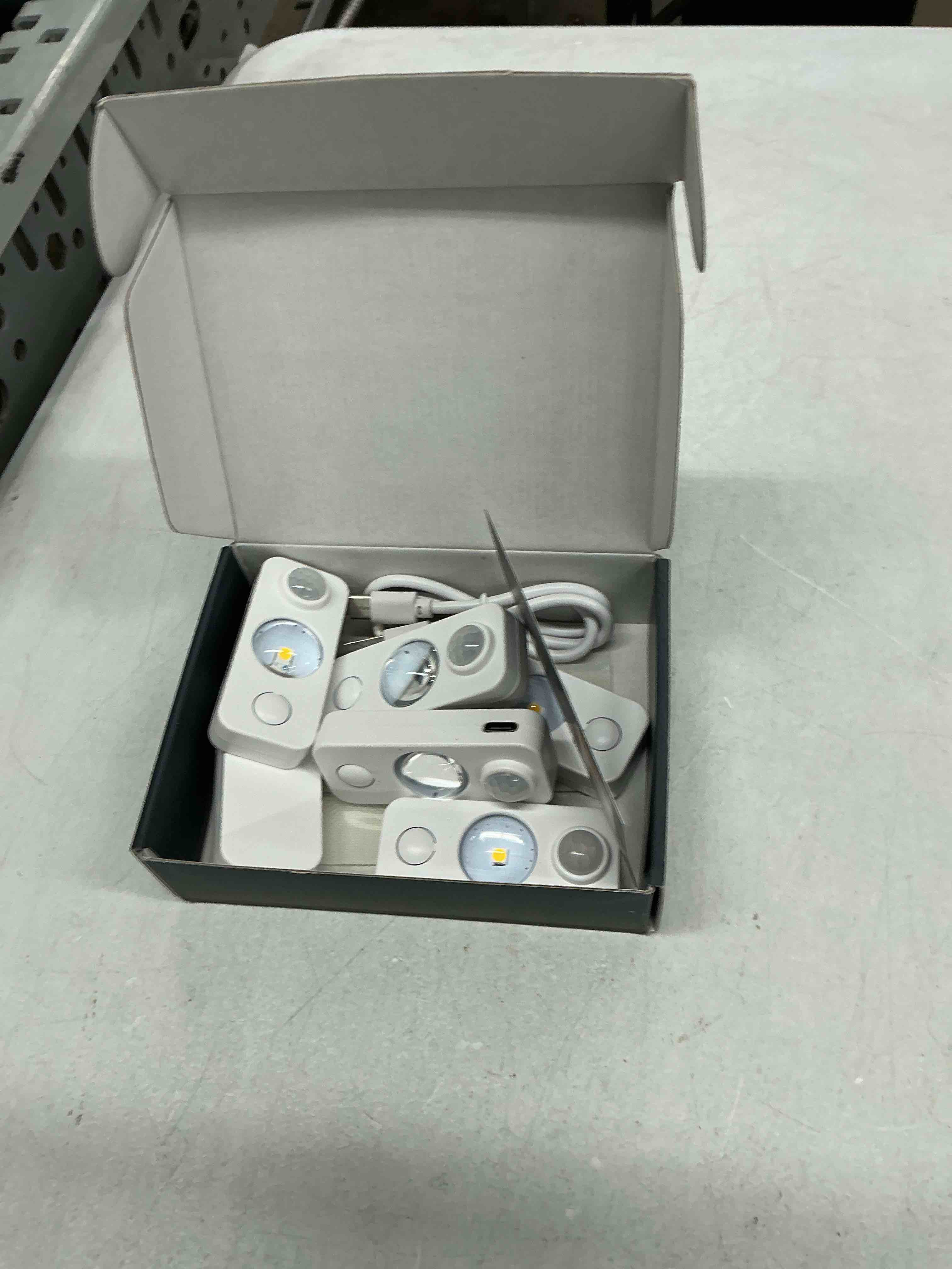 Condition photo showing Good Condition for niegnowoo led motion sensor puck lights, rechargeable cabinet lights, stick on wireless led night light for closet, drawer, shelf, under cabinet, warm white 6pack, usb charging cord included