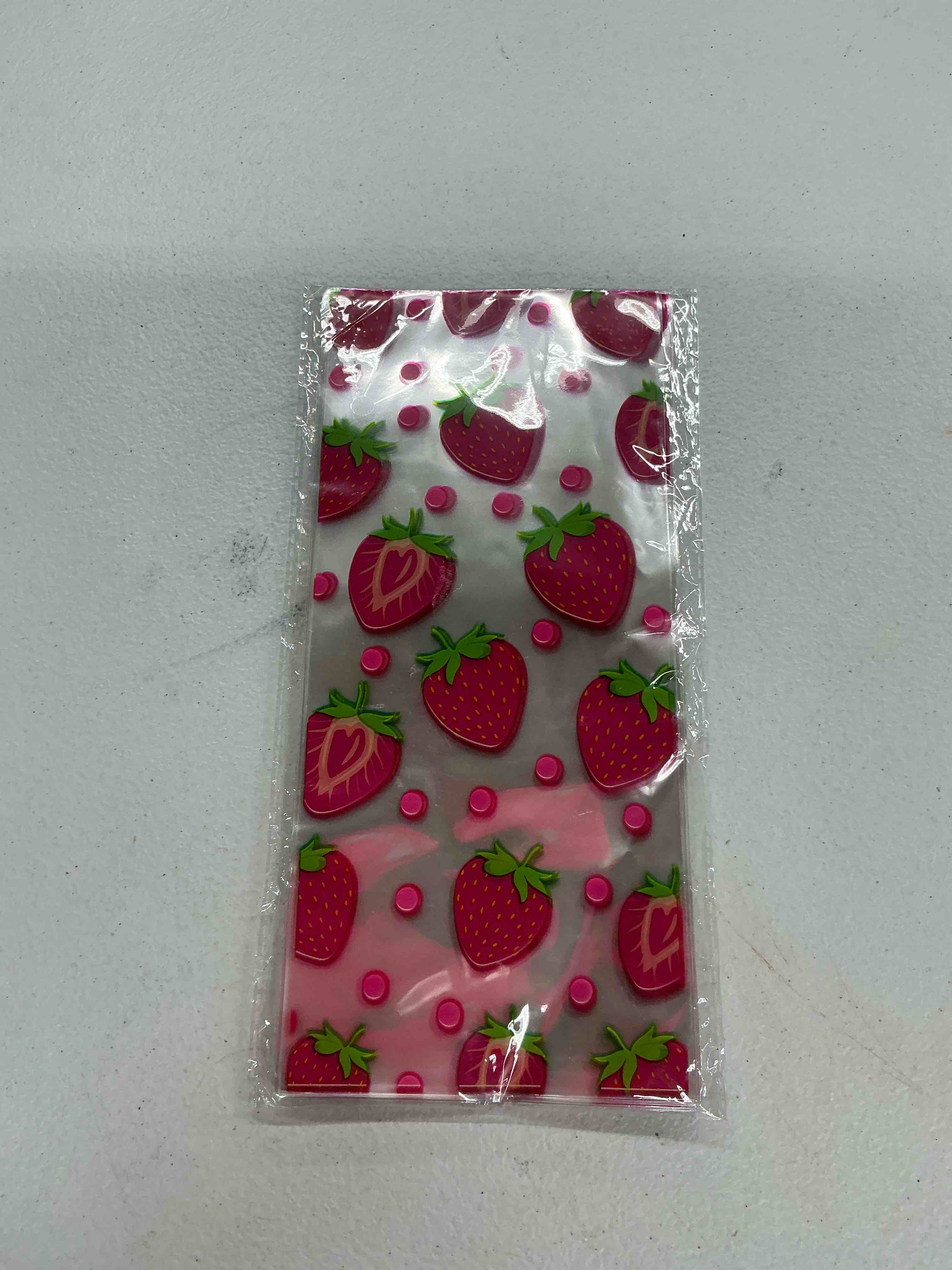 Condition photo showing Good Condition for 50-piece strawberry cello treat bags - clear plastic, twist tie, perfect for birthday parties