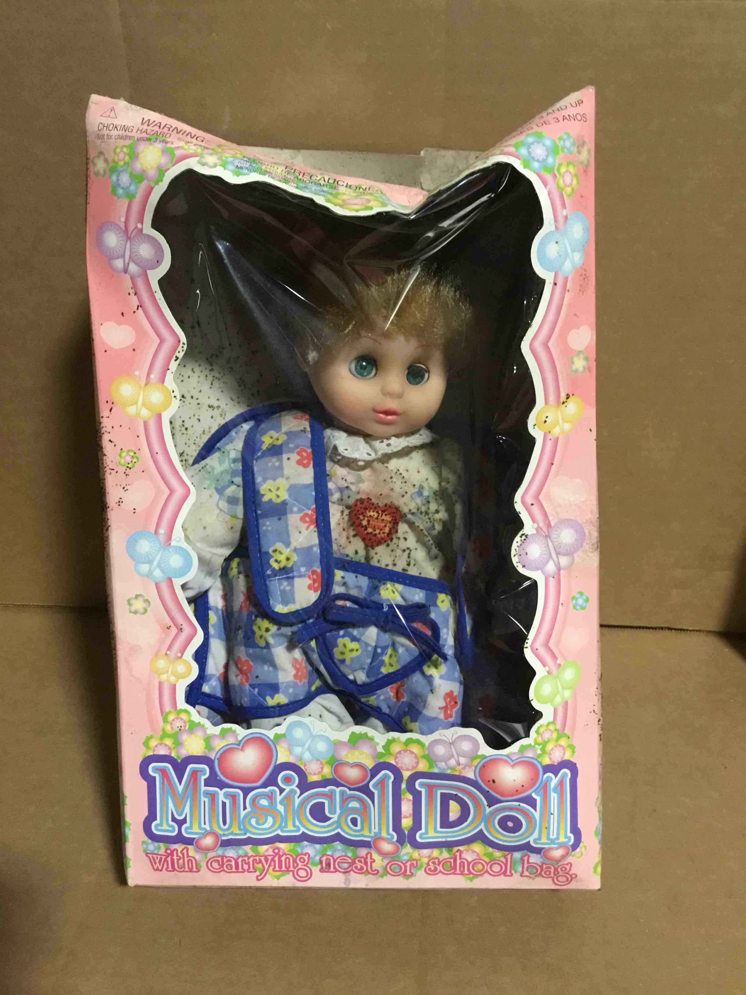 Musical Doll, with carrying nest or school bag