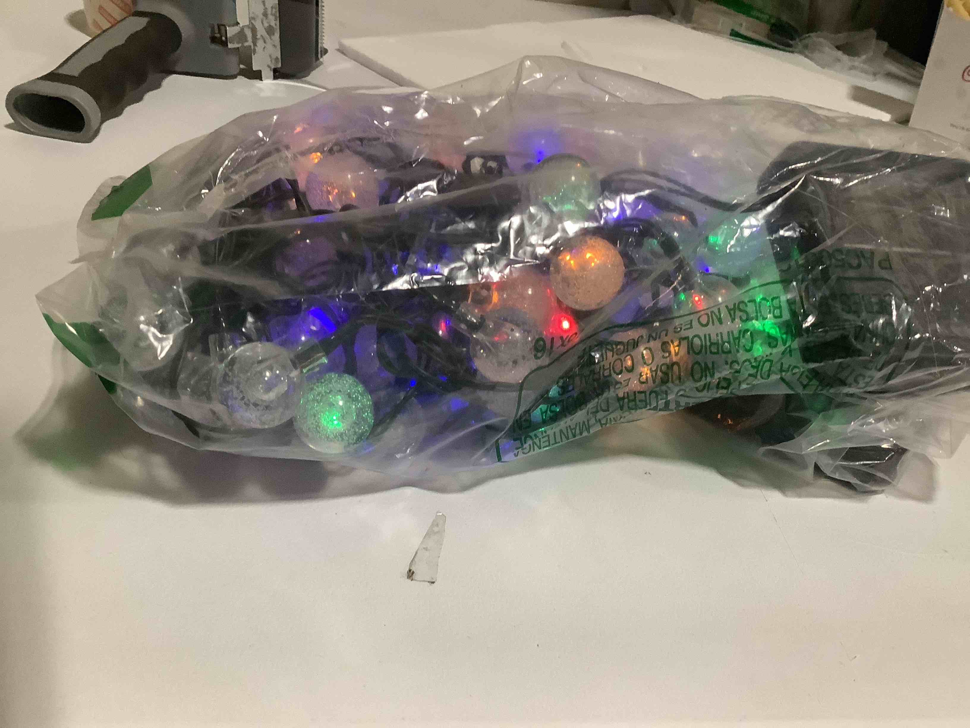 Condition photo showing As Is for Multicolor Solar Christmas String Lights Outdoor, 2-Pack 100 LED 64FT Crystal Globe Solar Lights Outdoor Waterproof with 8 Lighting Modes, Christmas Decorations for Xmas Tree Wedding Patio Party Multicolor 2 Pack-100LED(Solar)