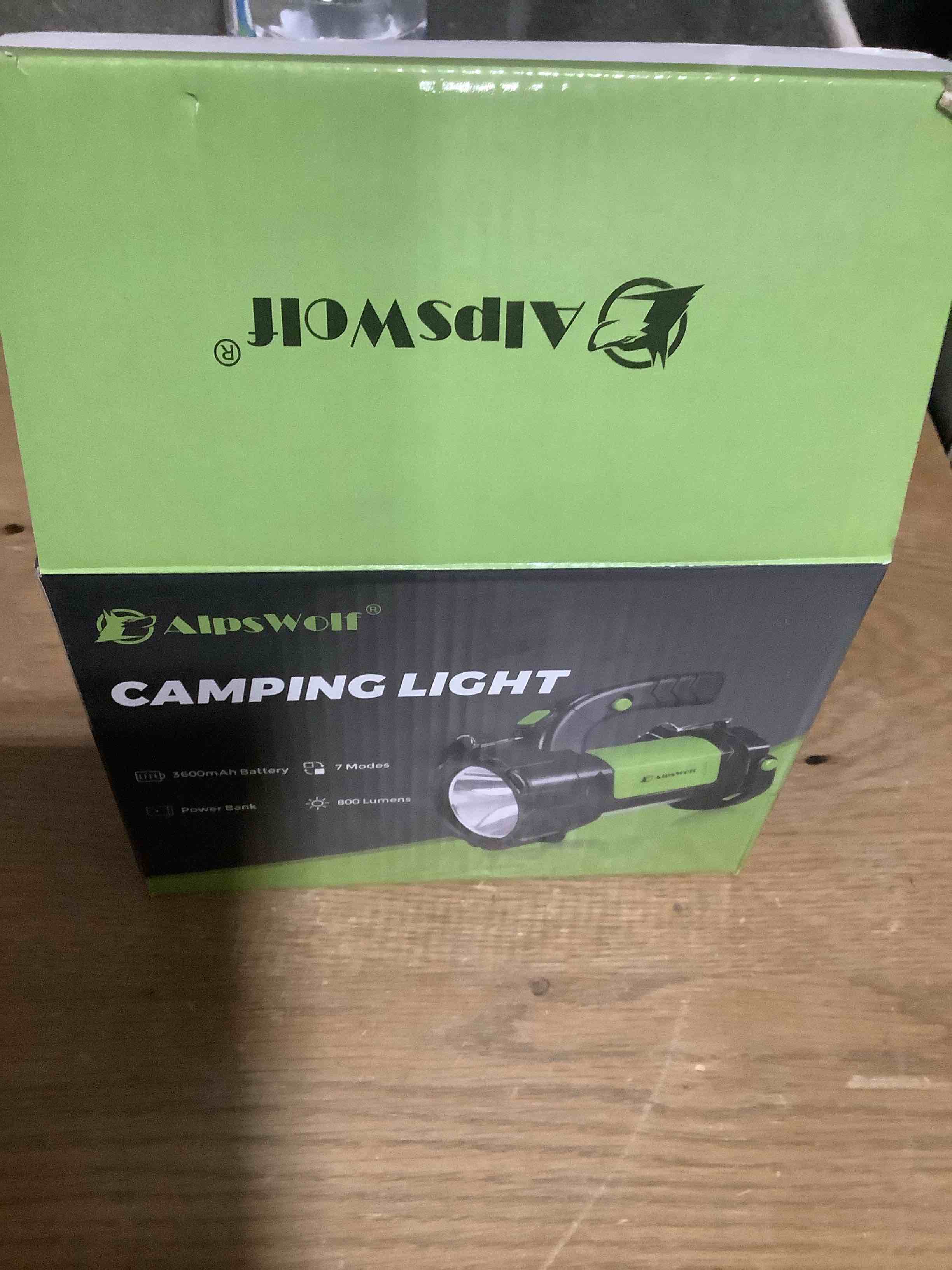 Condition photo showing New/Like New for AlpsWolf Camping Lantern Rechargeable, LED Flashlight Spotlight Lantern with 800LM, 3600 mAh, Strap Included Portable Bright Camping Light for Emergency, Outdoor Hiking, Power Outages Green-1pack