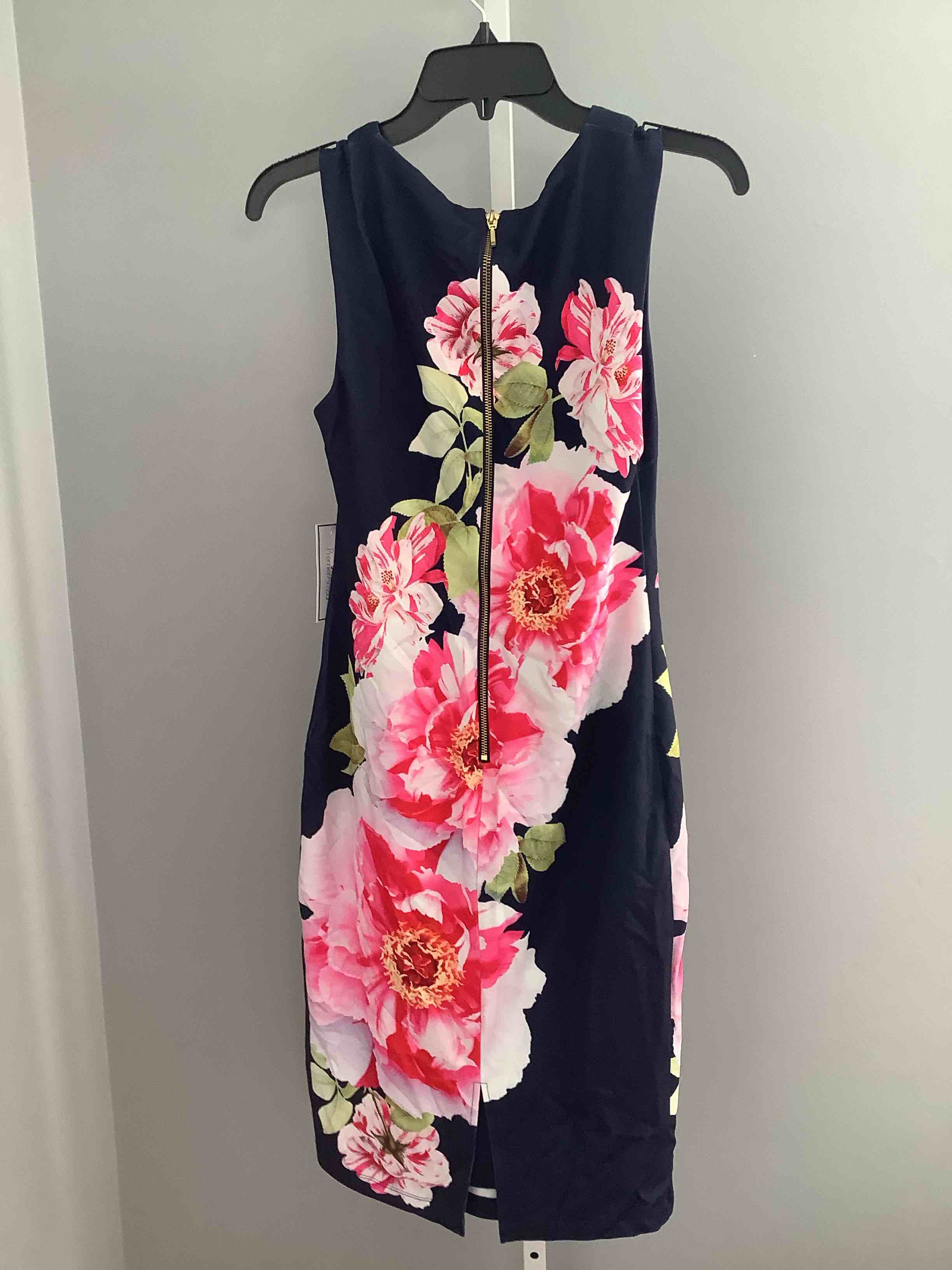 Condition photo showing New/Like New for premier armor floral midi dress. size 6, navy blush retail $74.
