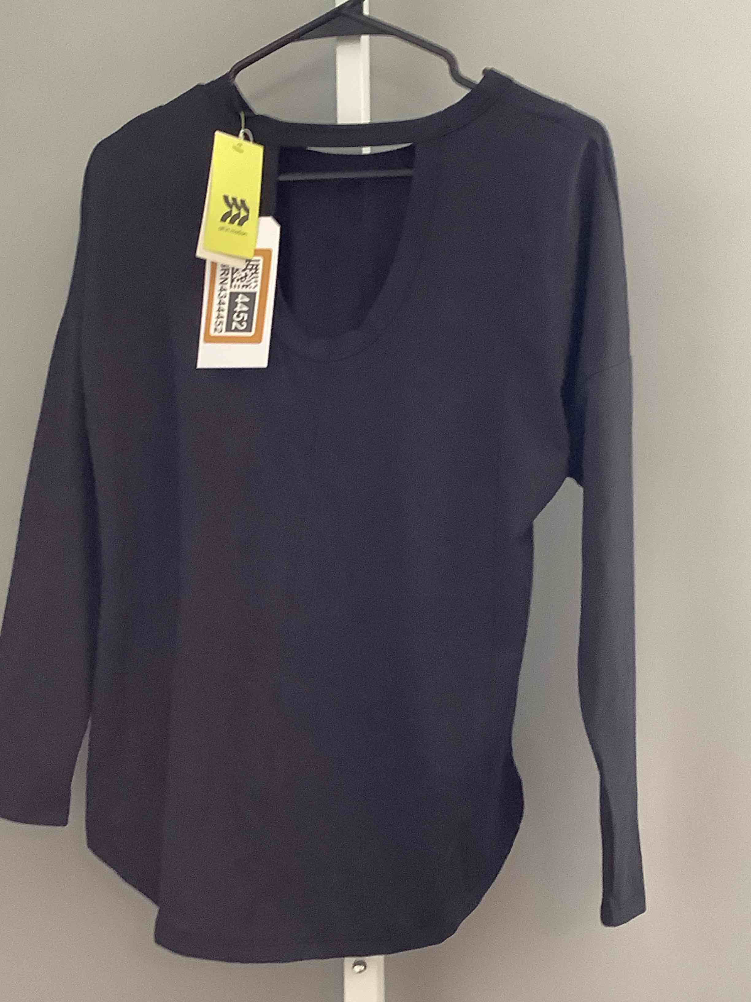 Condition photo showing New/Like New for all in motion women’s extra small black long sleeve athletic workout top keyhole neck