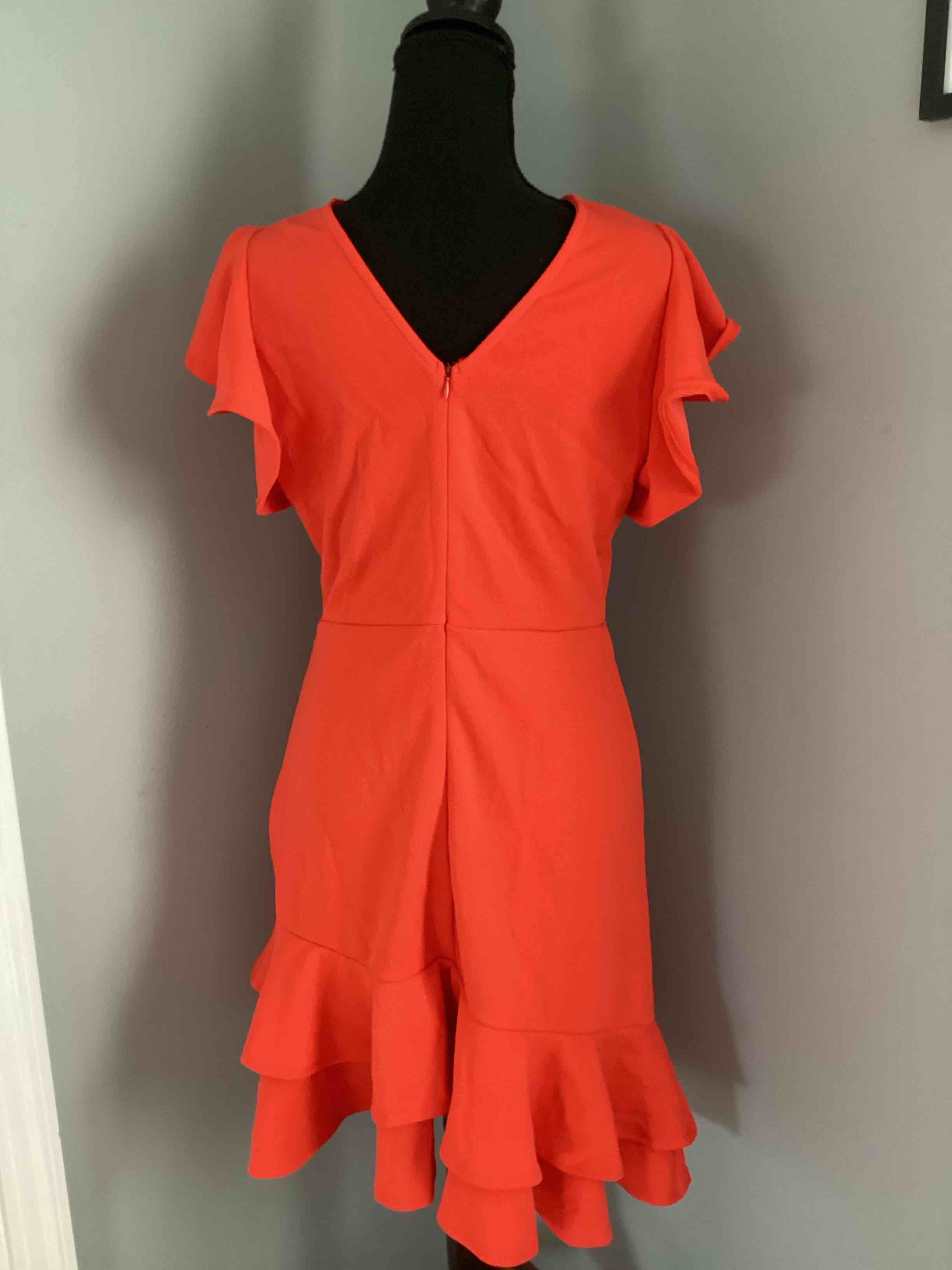 Condition photo showing Good Condition for orange ruffle dress with ruffle sleeves back zip size large