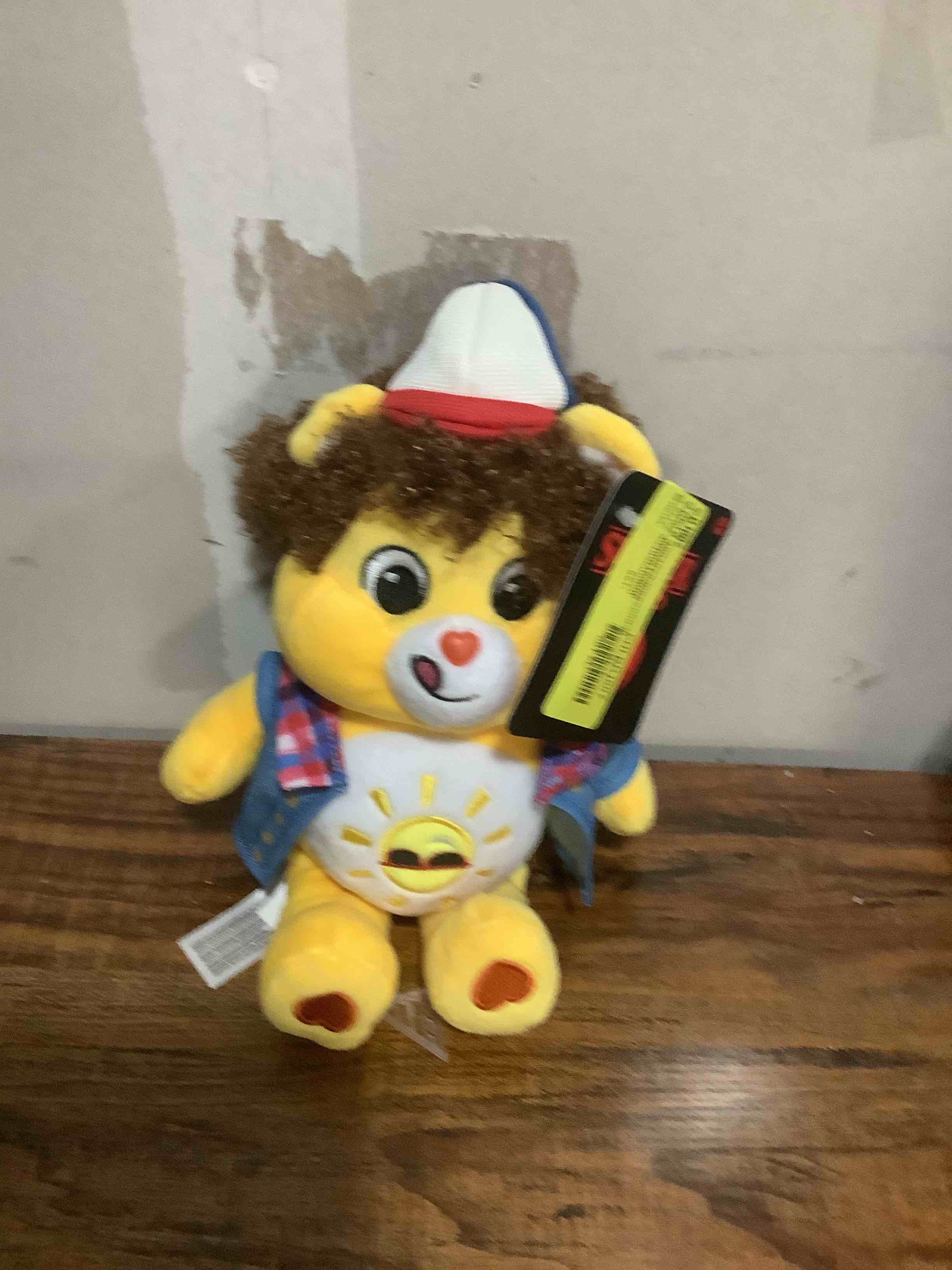 Condition photo showing New/Like New for Care Bears x Stranger Things Fun Size Plush - Funshine Bear as Dustin