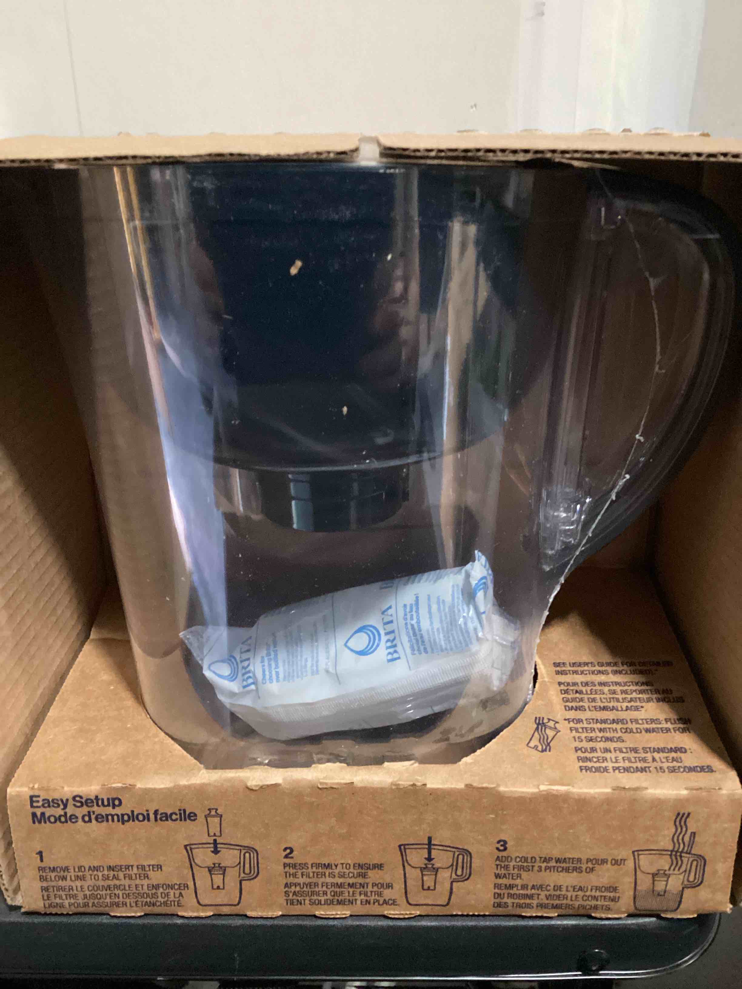 Condition photo showing New/Like New for brita large water filter pitcher for tap and drinking water, includes 1 standard filter, bpa-free, lasts two months, 10-cup capacity