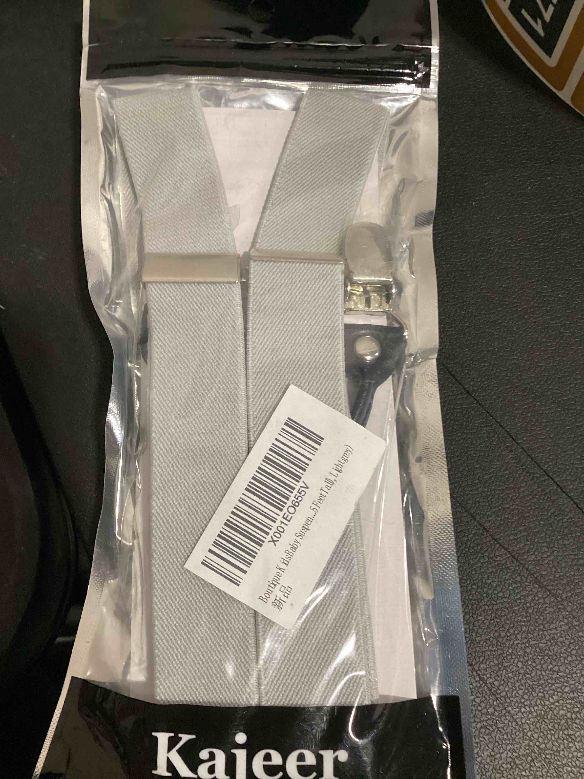 Condition photo showing New/Like New for light grey children suspenders