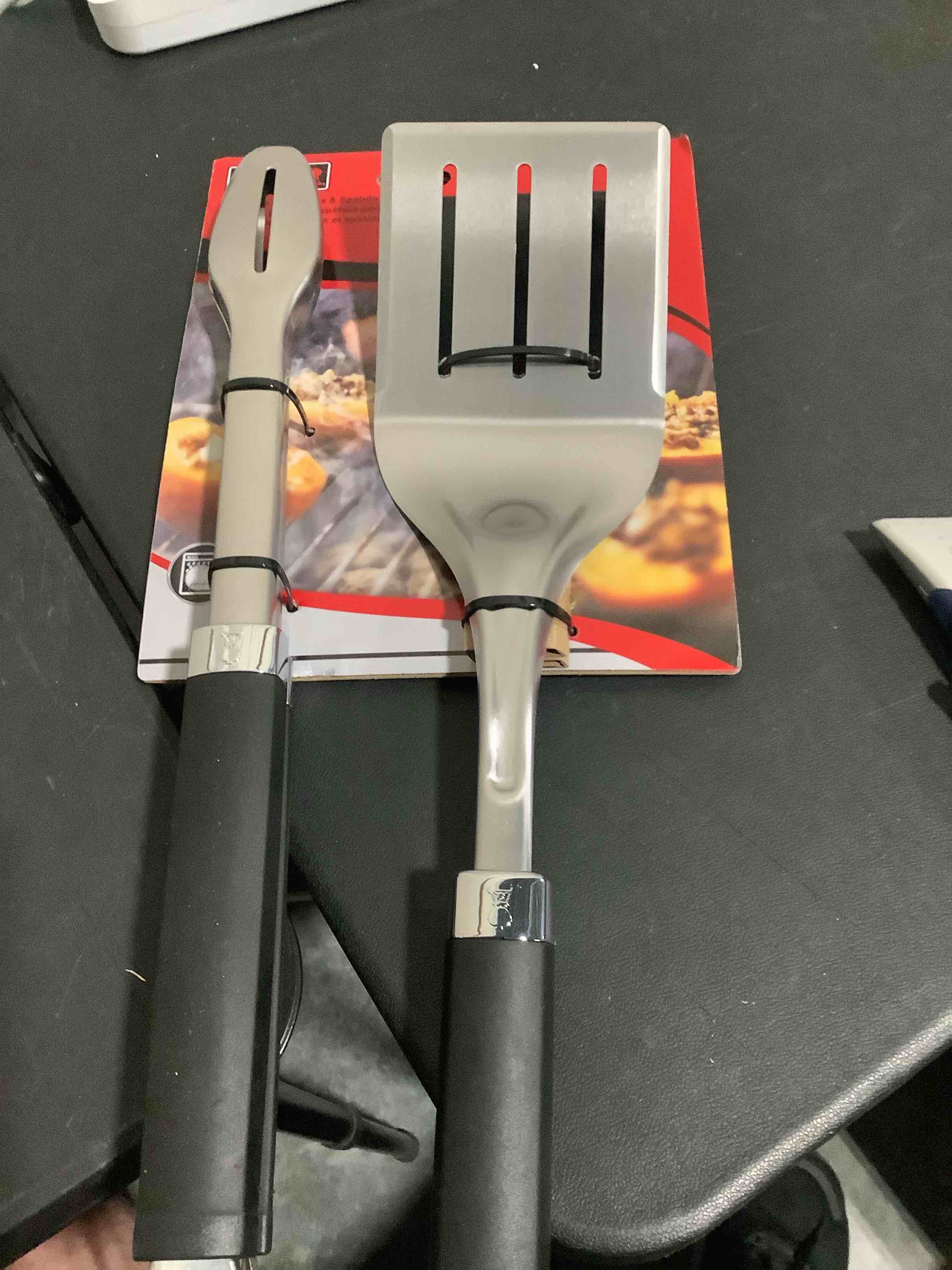 Condition photo showing New/Like New for weber precision tongs & spatula grilling tool set – stainless steel bbq tools with hands?free locking tongs, 3?sided beveled spatula, non?slip soft?touch handles grill tongs and spatula set