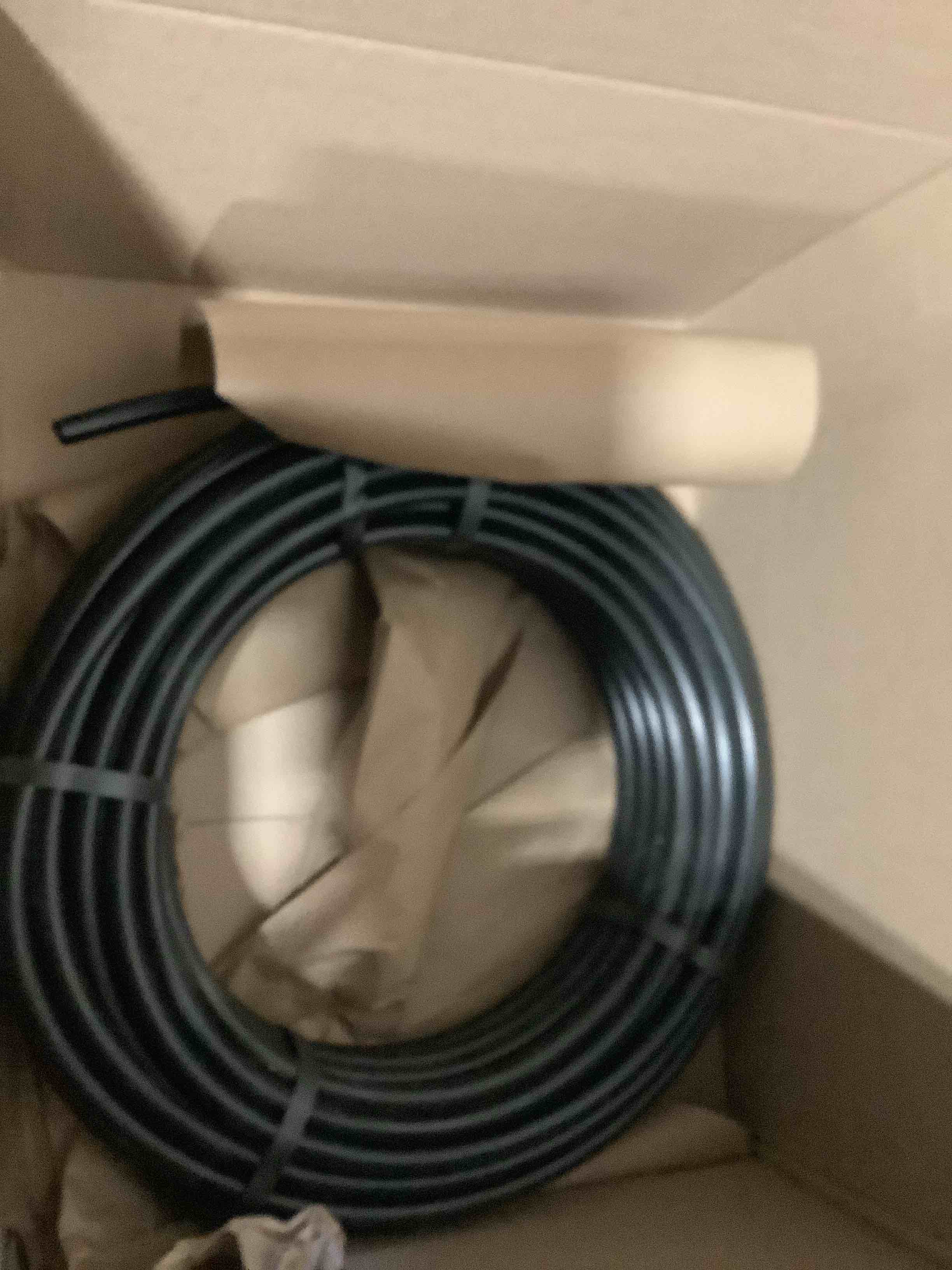 Condition photo showing As Is for raindrip 052010p 1/2 in. drip irrigation supply tubing, 100 ft., for emitters, irrigation parts, and drip systems,black polythyrene 100 feet hose black polyethylene