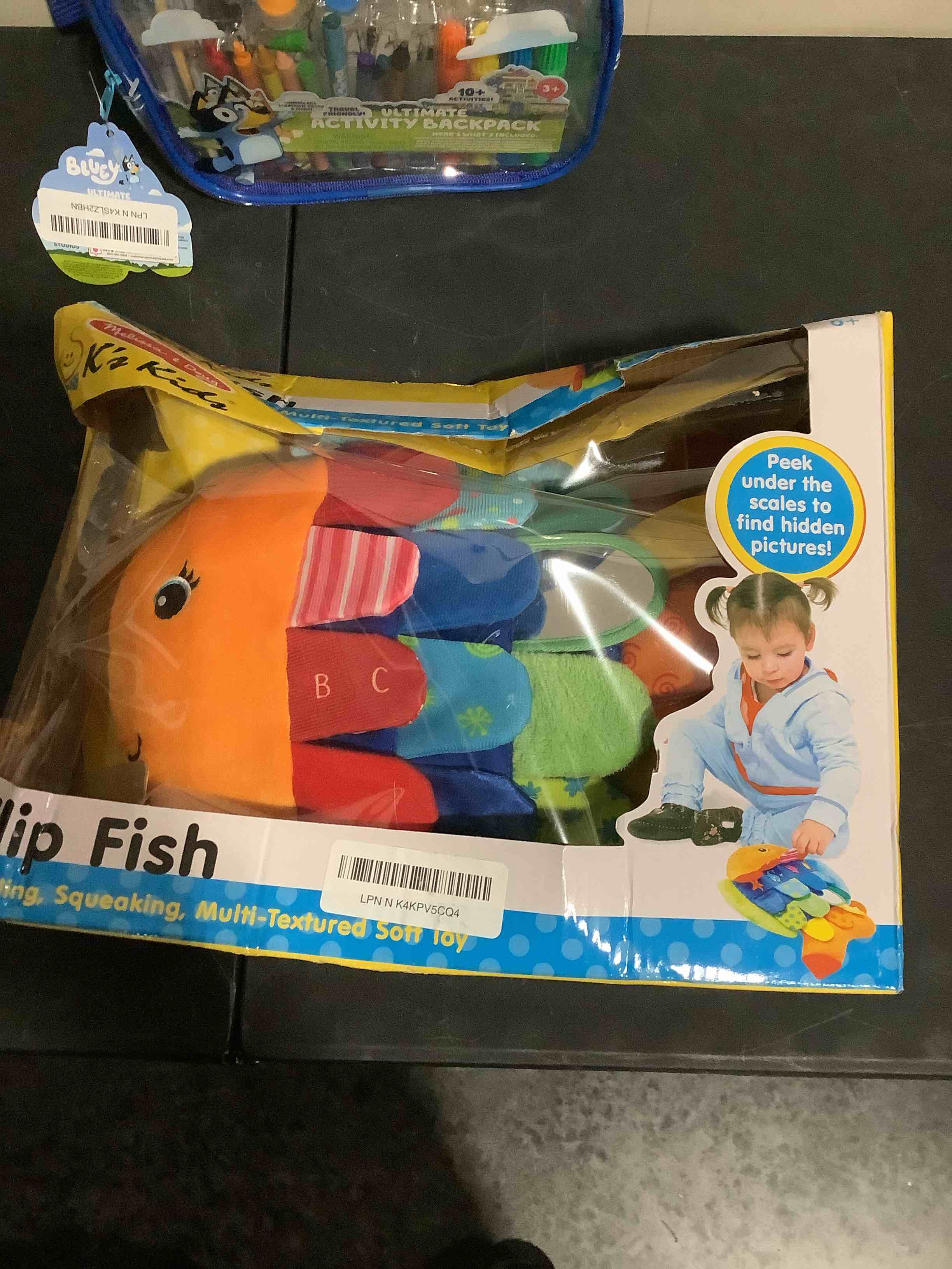 Condition photo showing New/Like New for melissa & doug flip fish soft baby toy