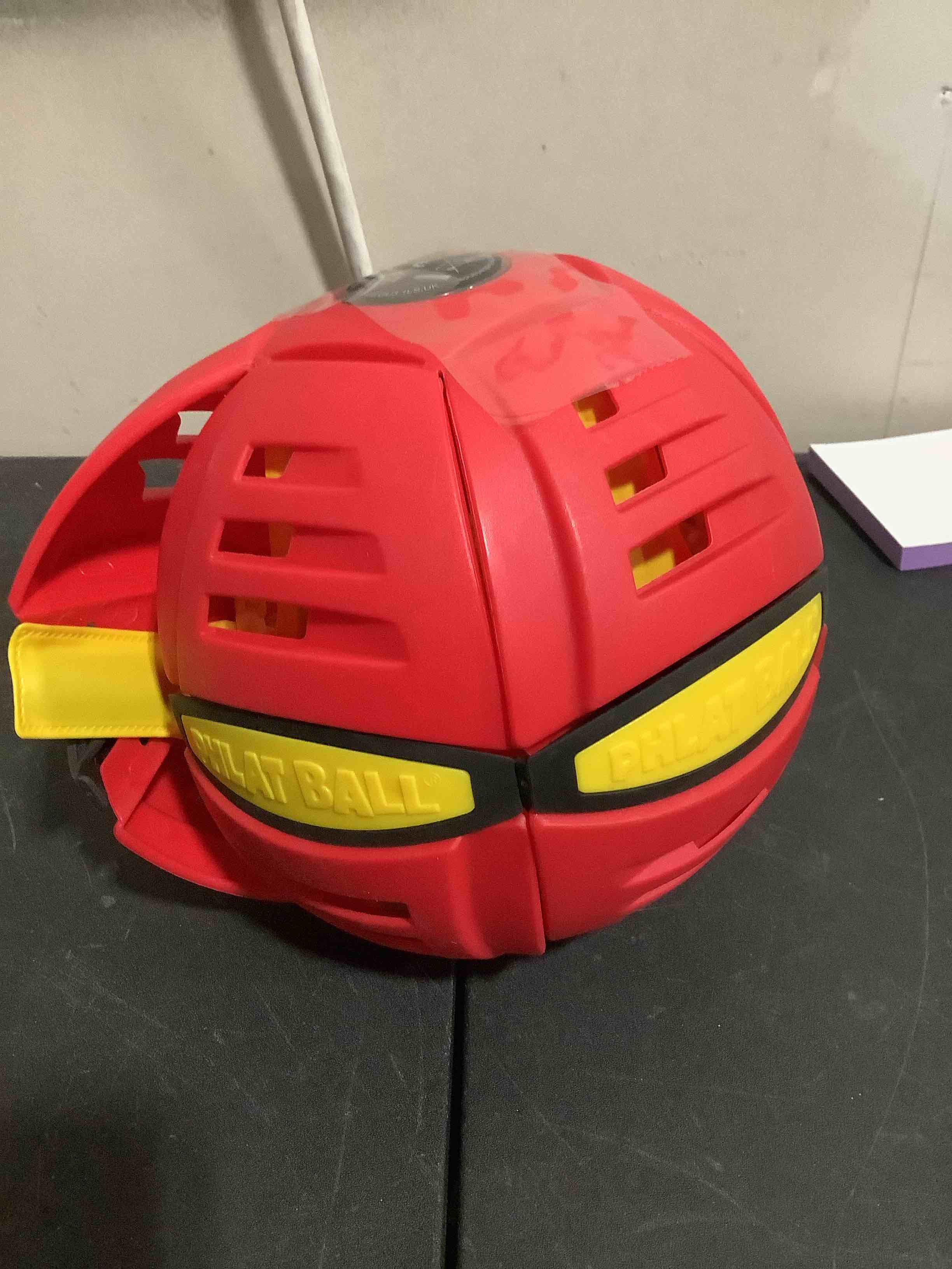 Condition photo showing As Is for magic metaball, magic bouncing ball, magic flying saucer interactive pop up balls, transform toy, parent child interaction red bouncy ball, collapsible time delay frisbee flying disc toy with 6 light