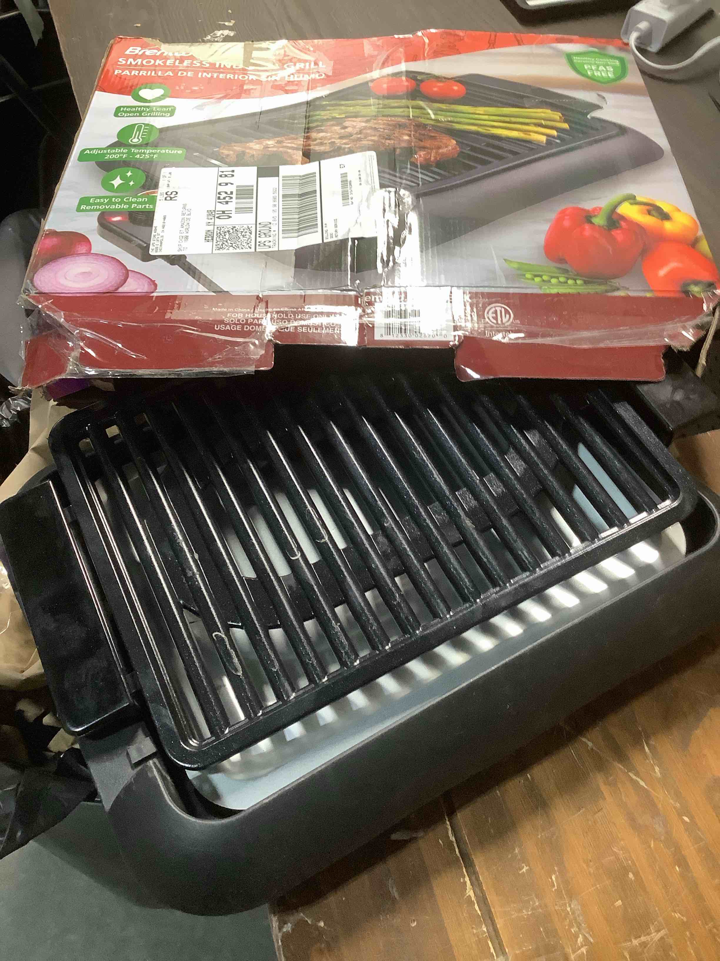 Condition photo showing As Is for Brentwood 1200W Electric Smokeless Indoor Grill with Ceramic Non-Stick Surface, Adjustable Temperature, and Dishwasher Safe Parts, 12.6” x 10”, Black