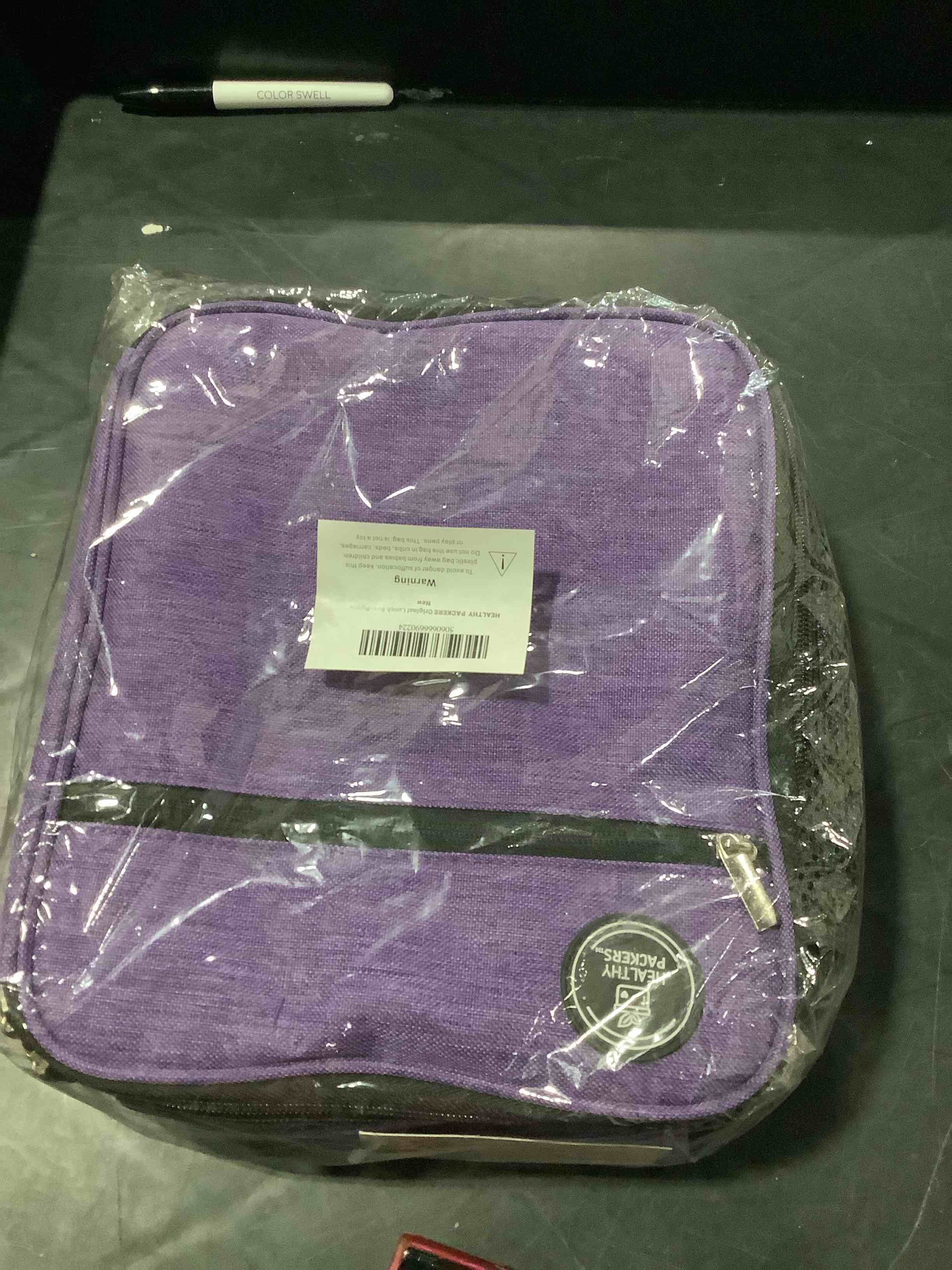 Condition photo showing New/Like New for healthy packers insulated lunch bag with water bottle holder (purple)