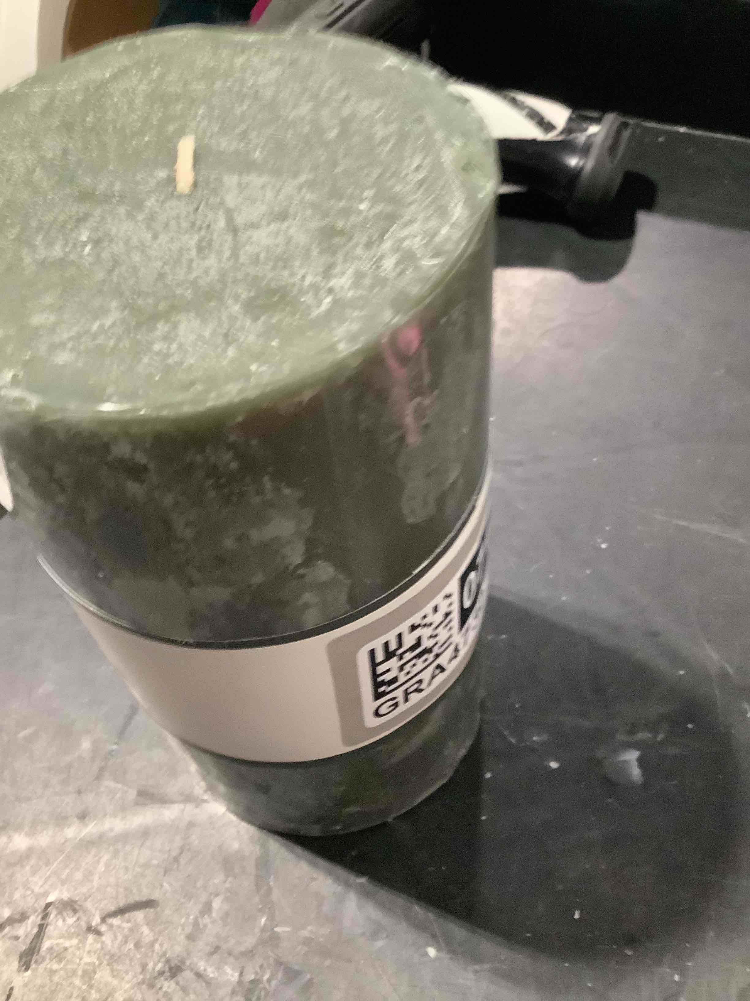 Condition photo showing New/Like New for 7" x 4" pillar candle charcoal and black teak - threshold™: aromatic, long burn time