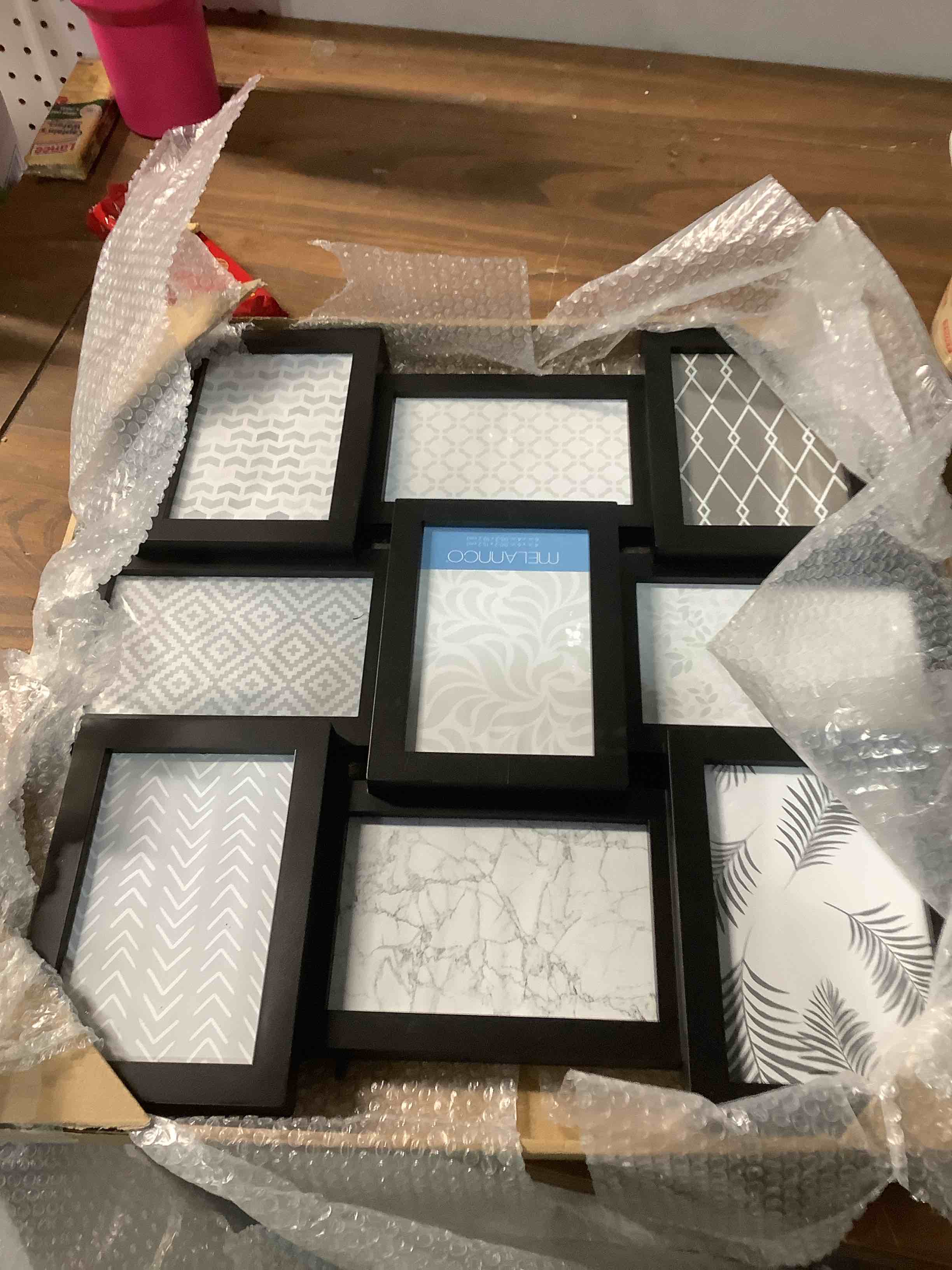 Condition photo showing Good Condition for Melannco 18 Inch Black Collage Picture Frame - Multi-photo Frame with 9 Openings - Four 6x4 and Five 4x6 Slots - Wall-mounted Gallery Frame for Family Photos - Home Decor Multi Picture Frame 9 Opening Black