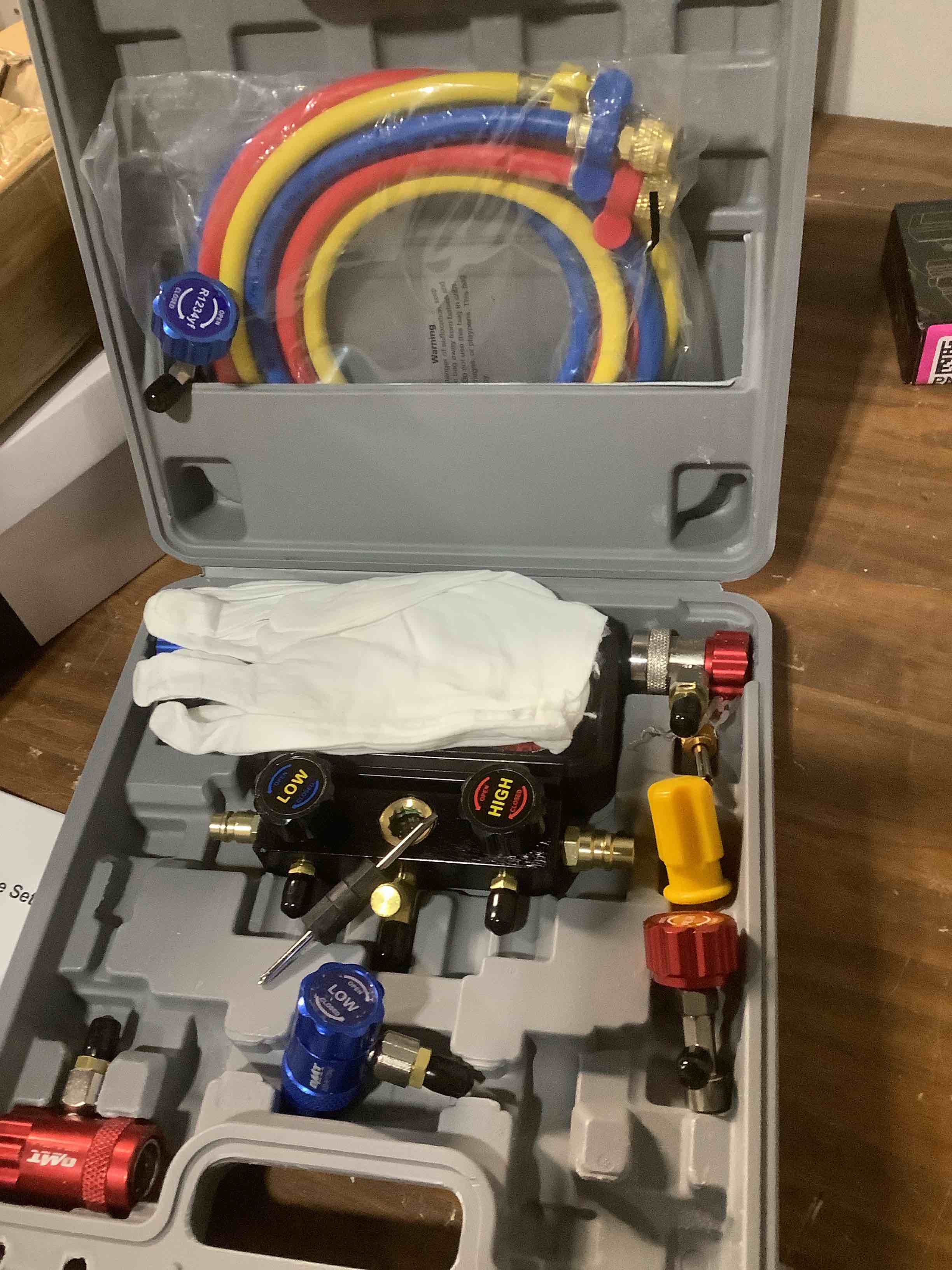 Condition photo showing Good Condition for Orion Motor Tech AC Gauges, 3 Way Manifold Gauge Set for R1234yf R404a R134a Refrigerant, Automotive Gauge Set with Hoses Quick Couplers Self Sealing Can Taps for Car Freon Charging & Evacuation